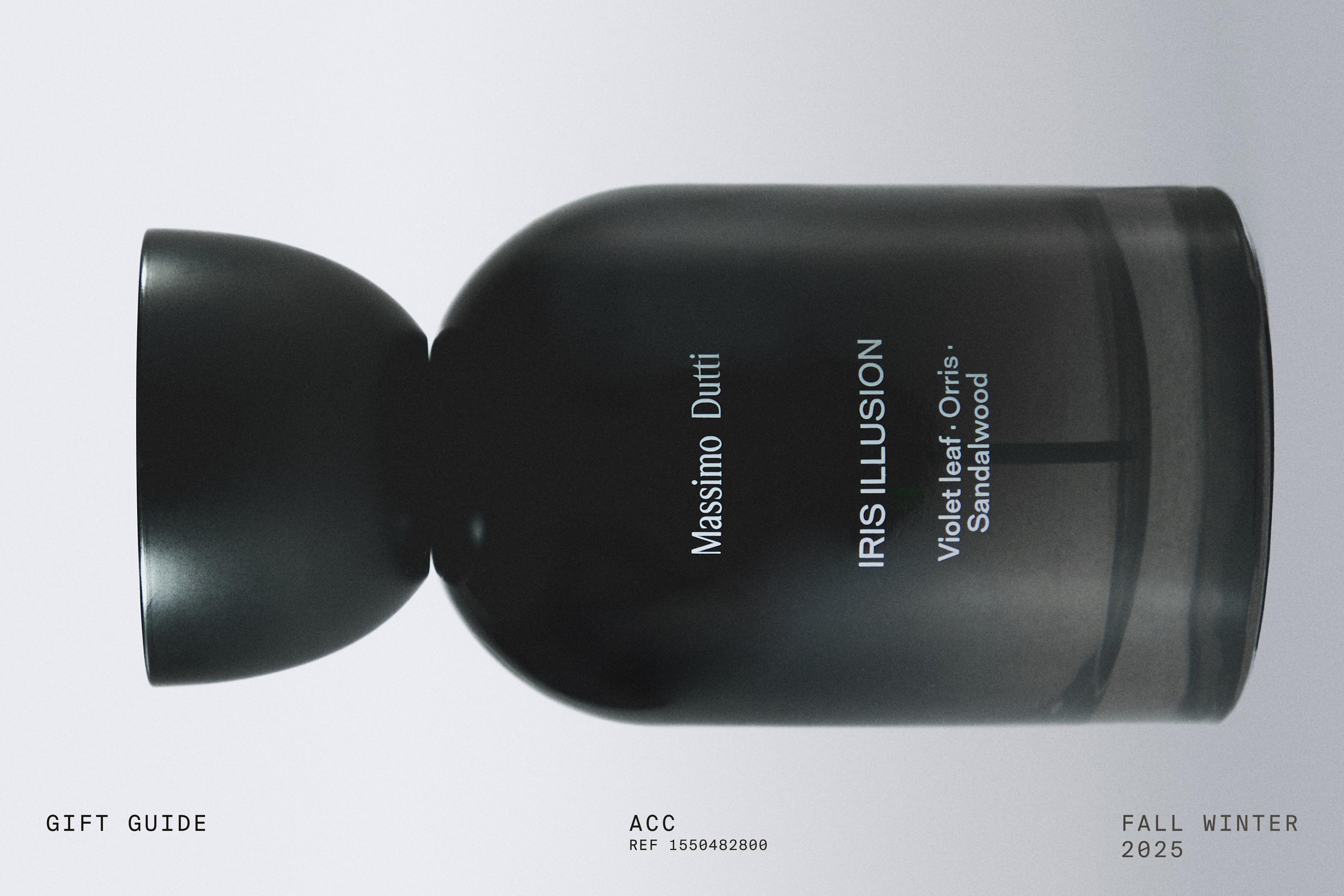 Botella de perfume negro con texto "Massimo Dutti", "IRIS ILLUSION", "Violet leaf, Orris, Sandalwood".