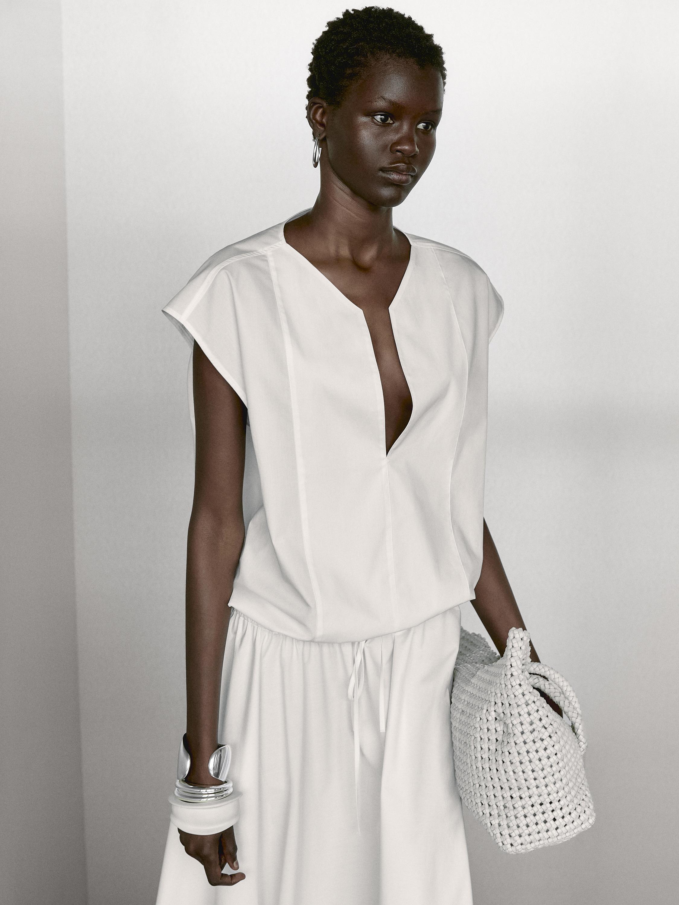 Blusa de popelina com pormenor de elástico em algodão