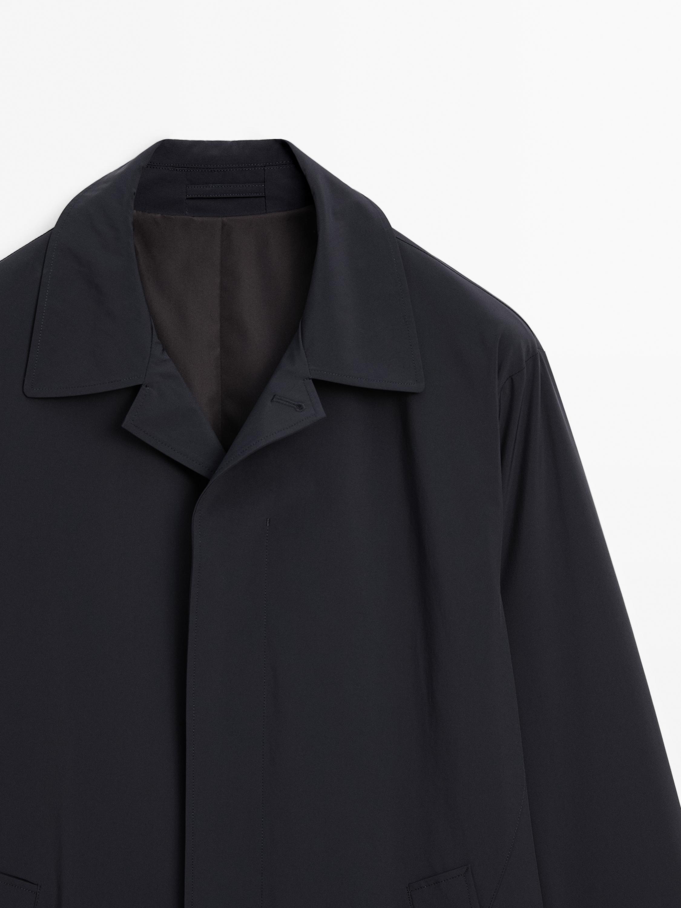 Lightweight trench coat with hidden buttons