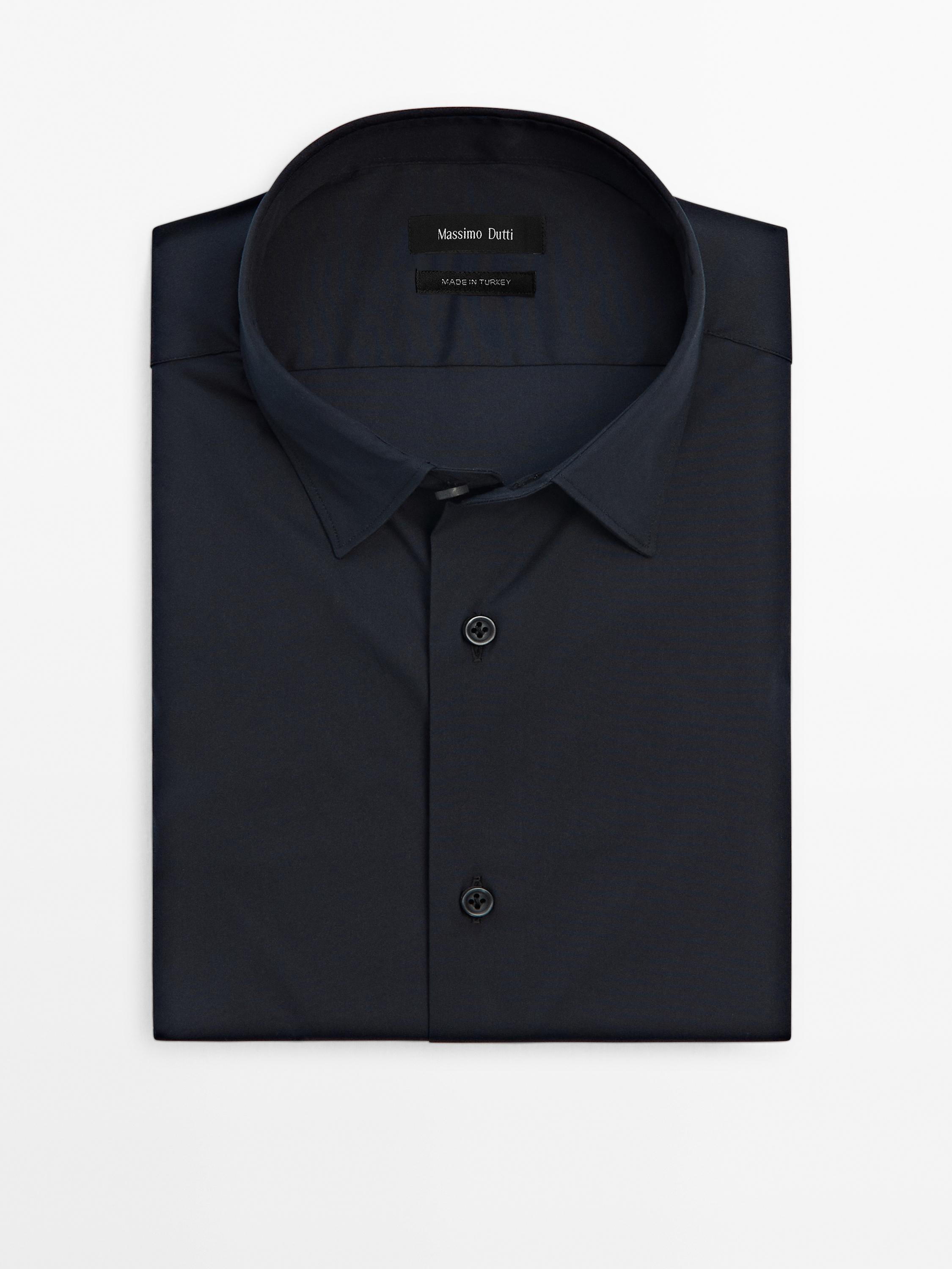 Front view of a black shirt with a classic collar and button fastening, 'Massimo Dutti' label and 'Made in Turkey'.