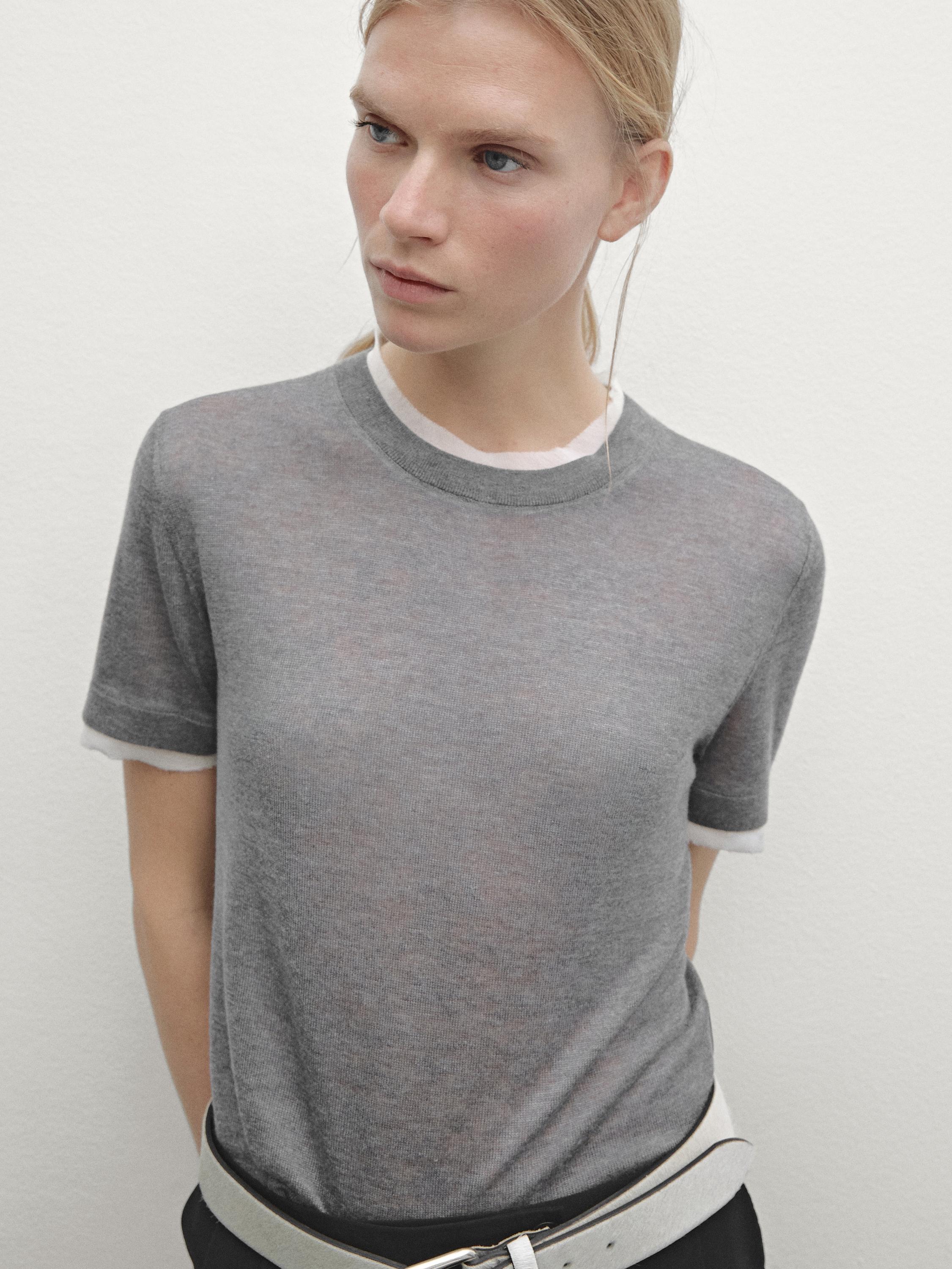 Knit sweater with short sleeves and distressed detail