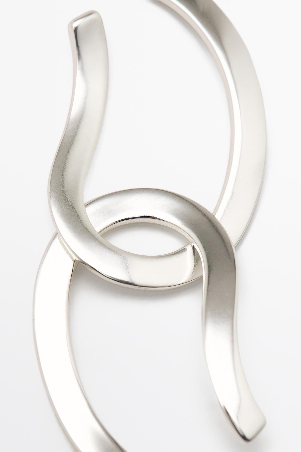 Twisted oval hoop earrings — SILVER