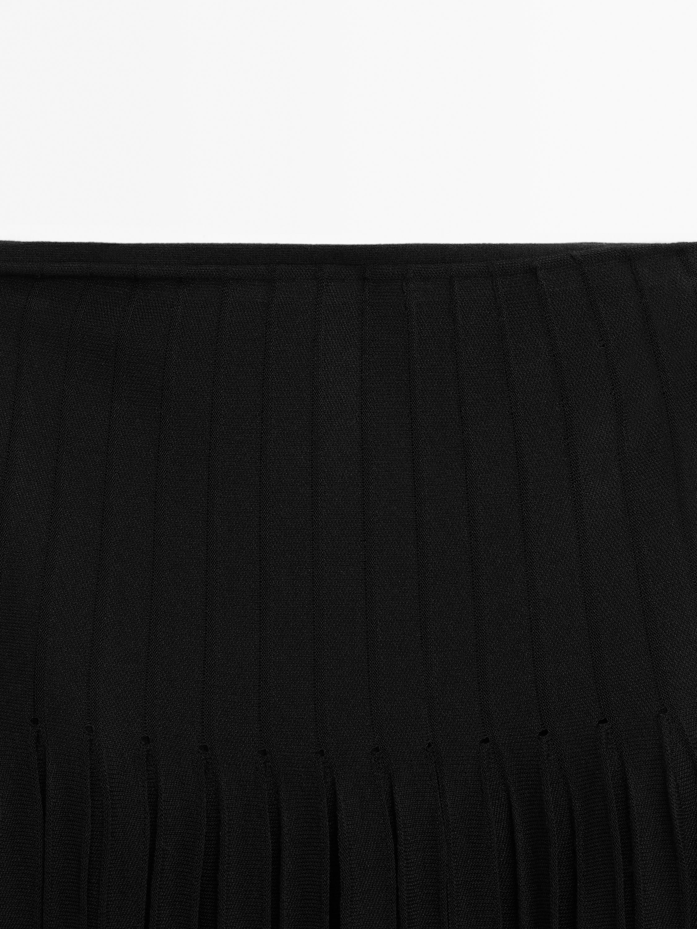 Jupe midi plissée transparences