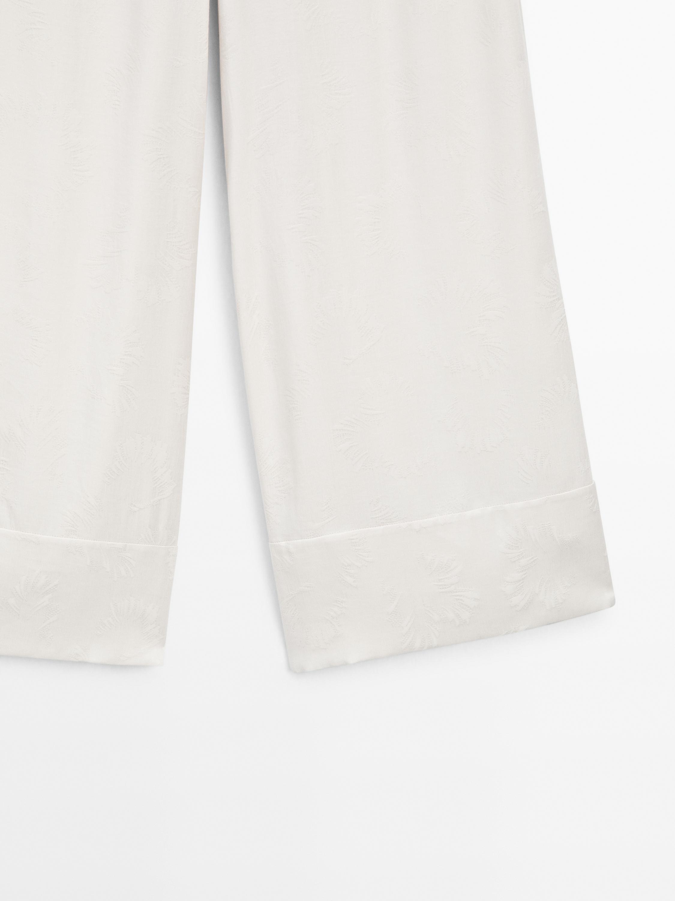 Printed fabric trousers with hem detail