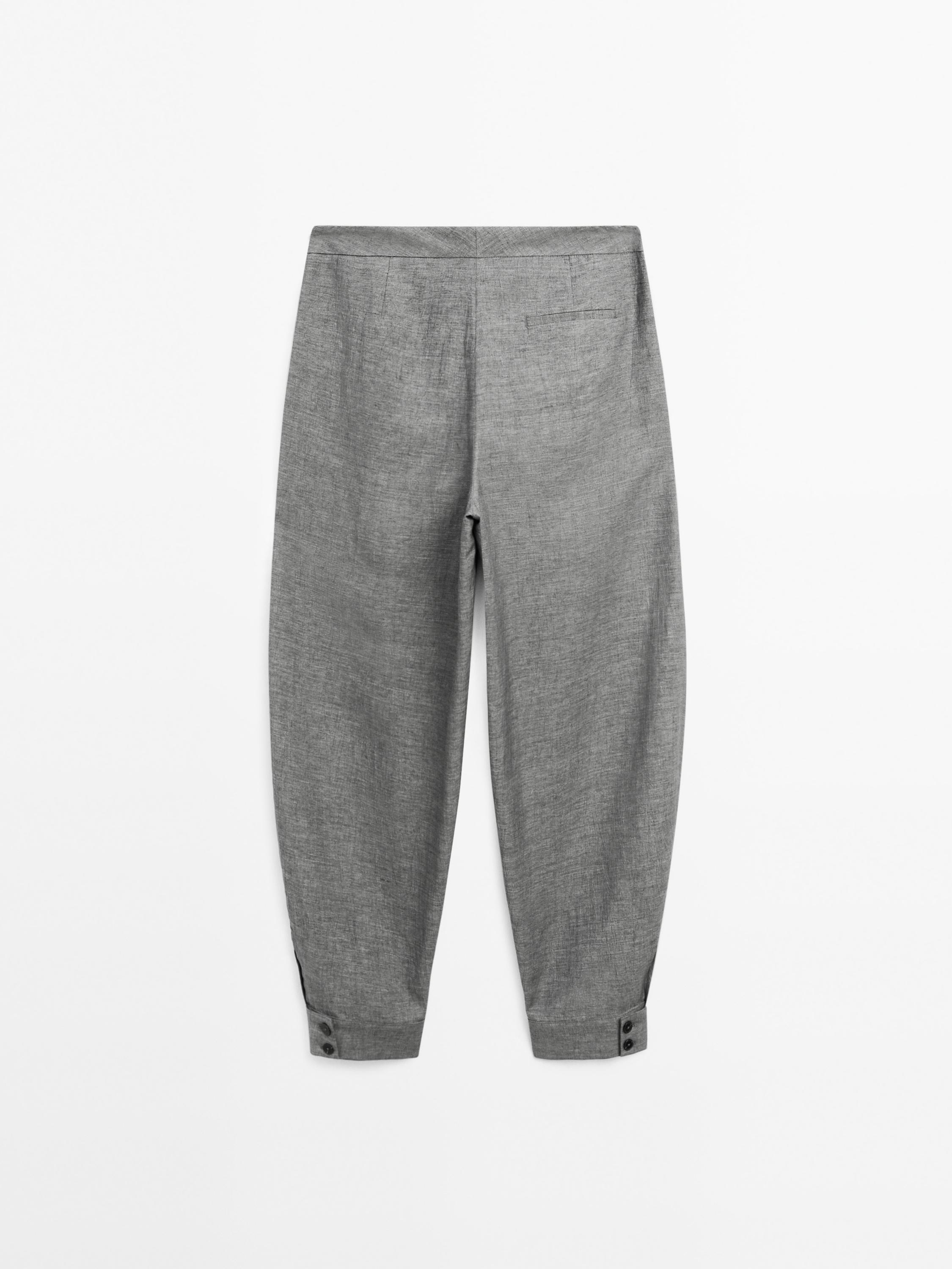 Balloon fit trousers with button details