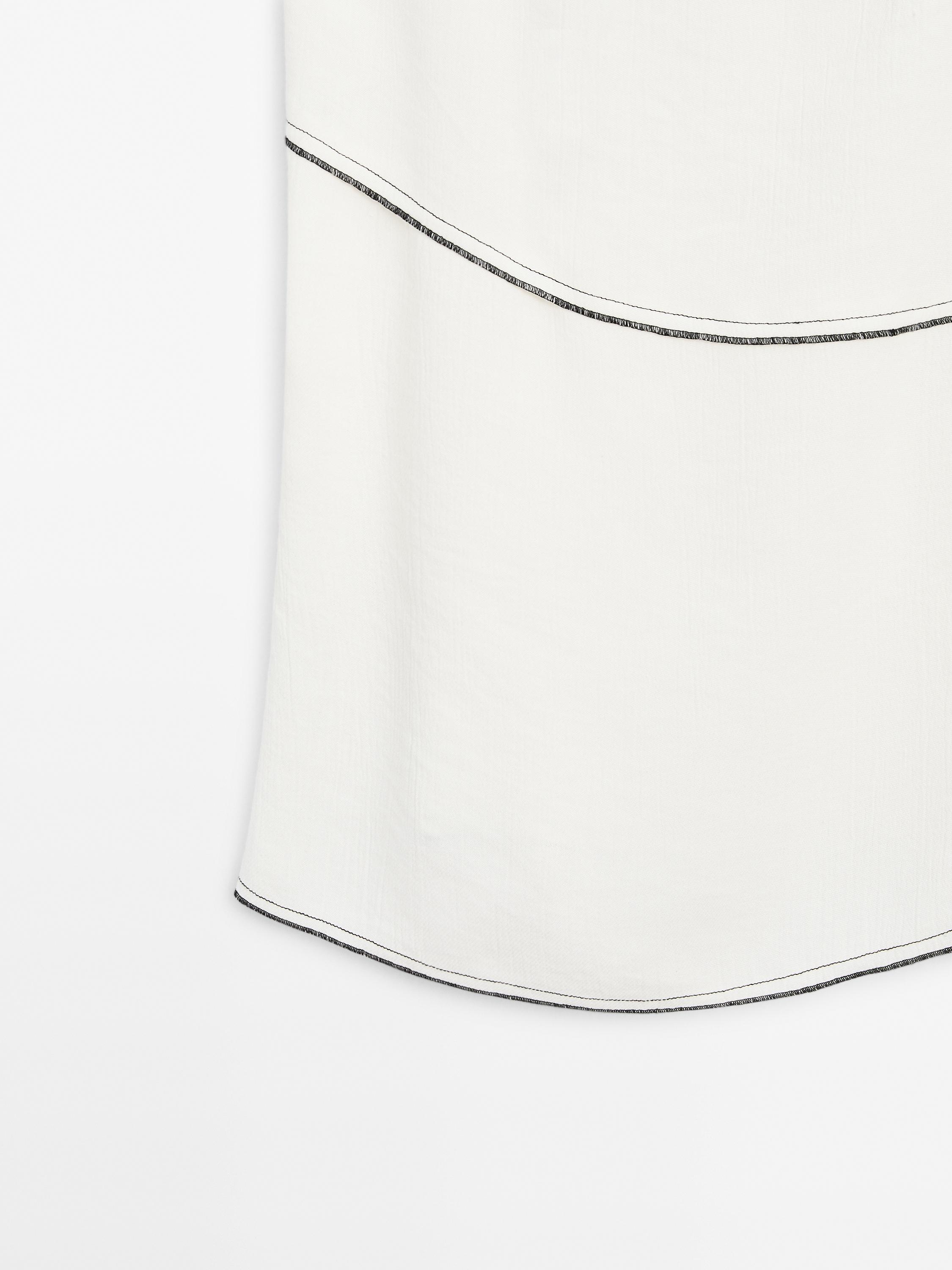 Flowing top with topstitching detail