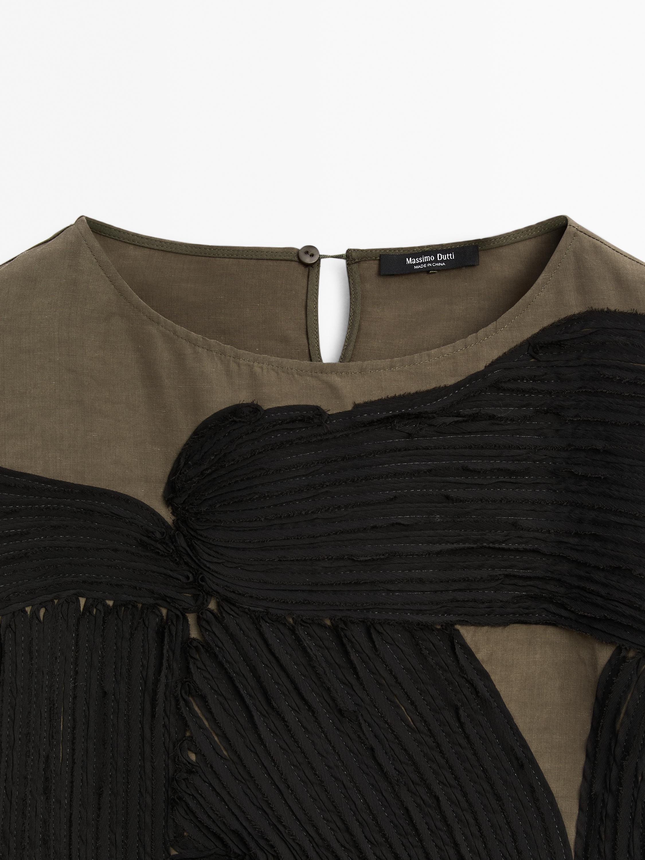 Flowing blouse with contrasting ribbons