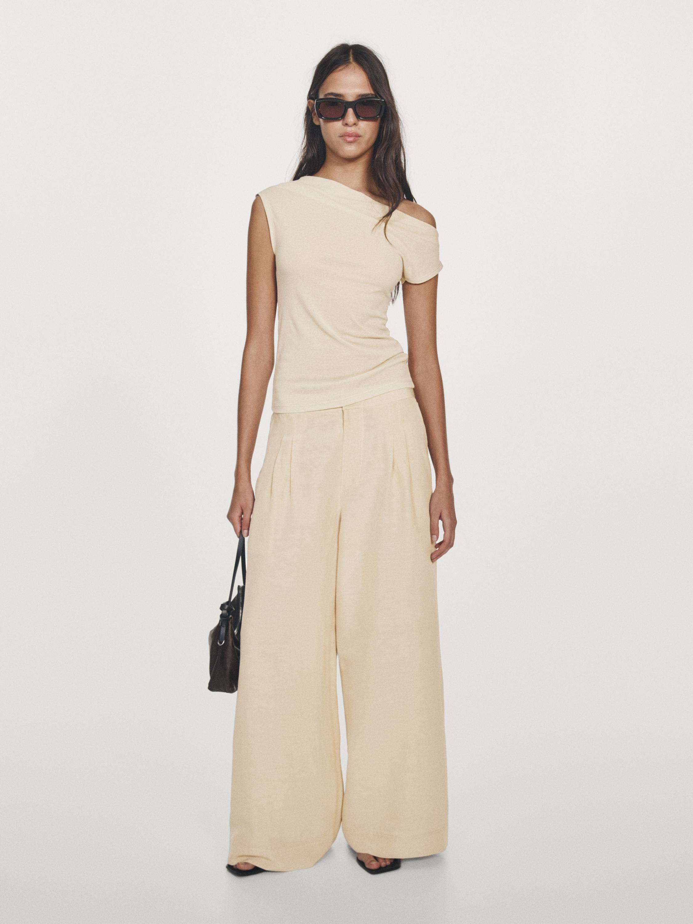 Top asimétrico sin mangas