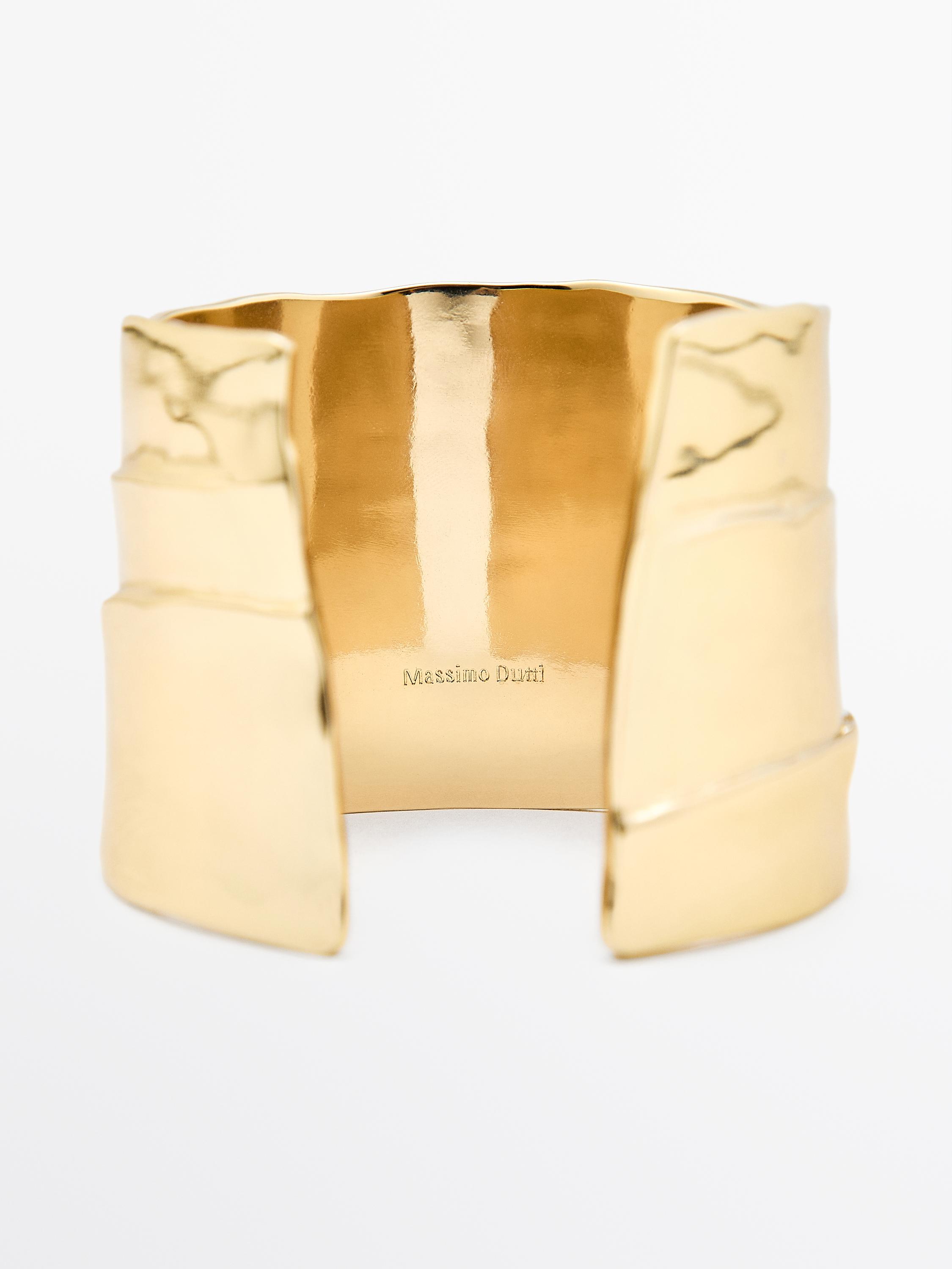 Brazalete metálico pliegue