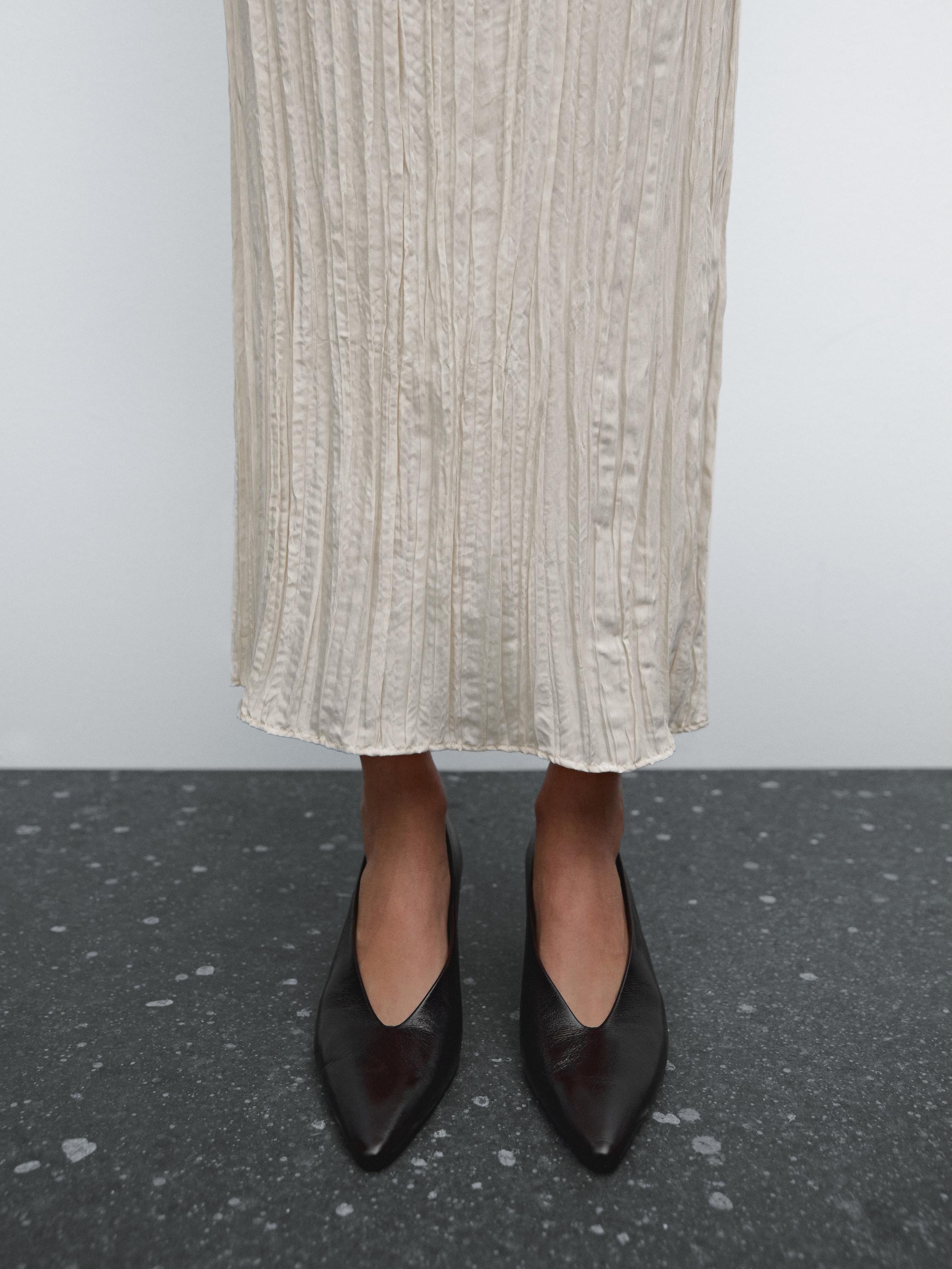 Flowing pleated midi skirt