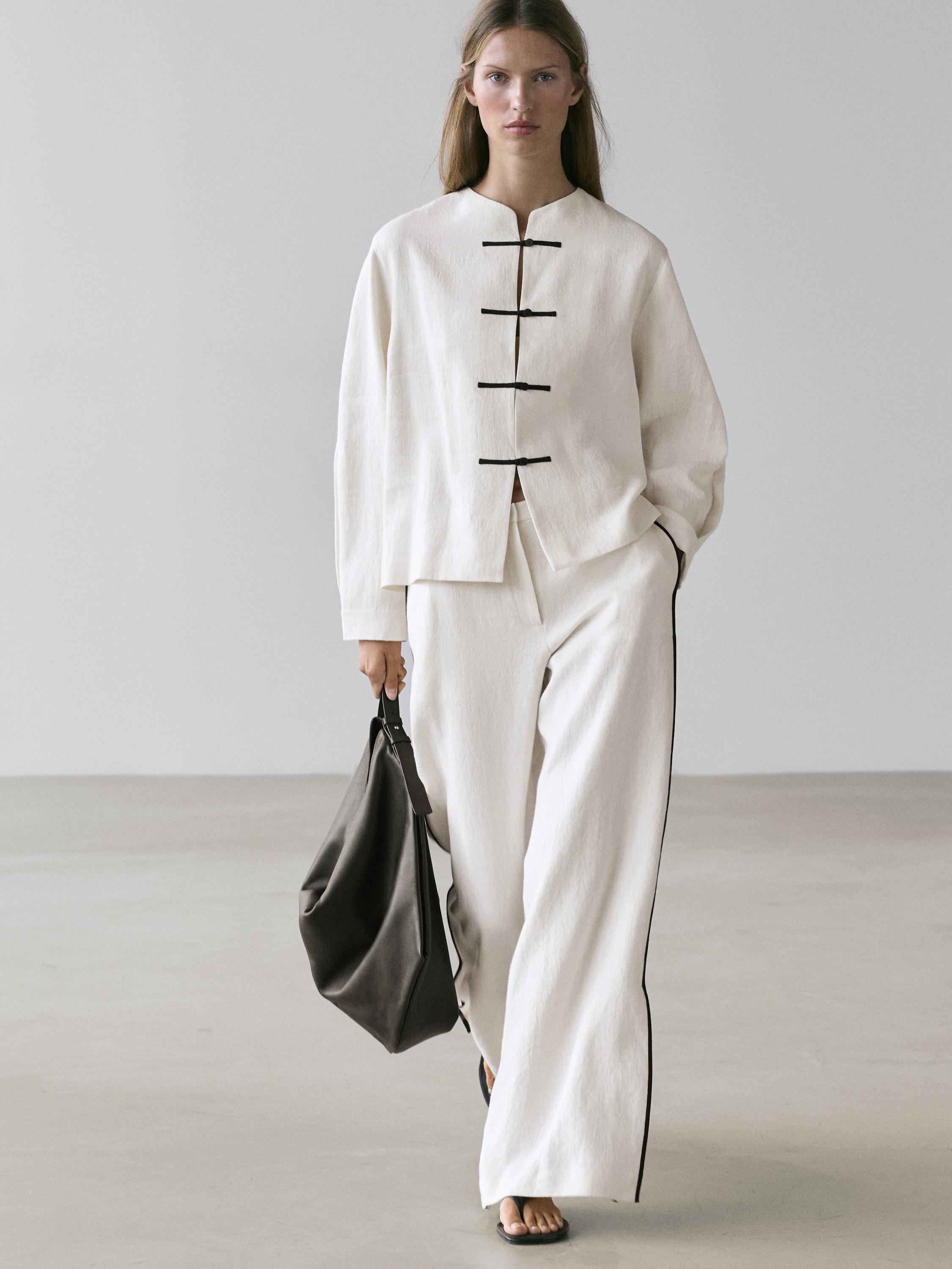 Linen trousers with contrast piping