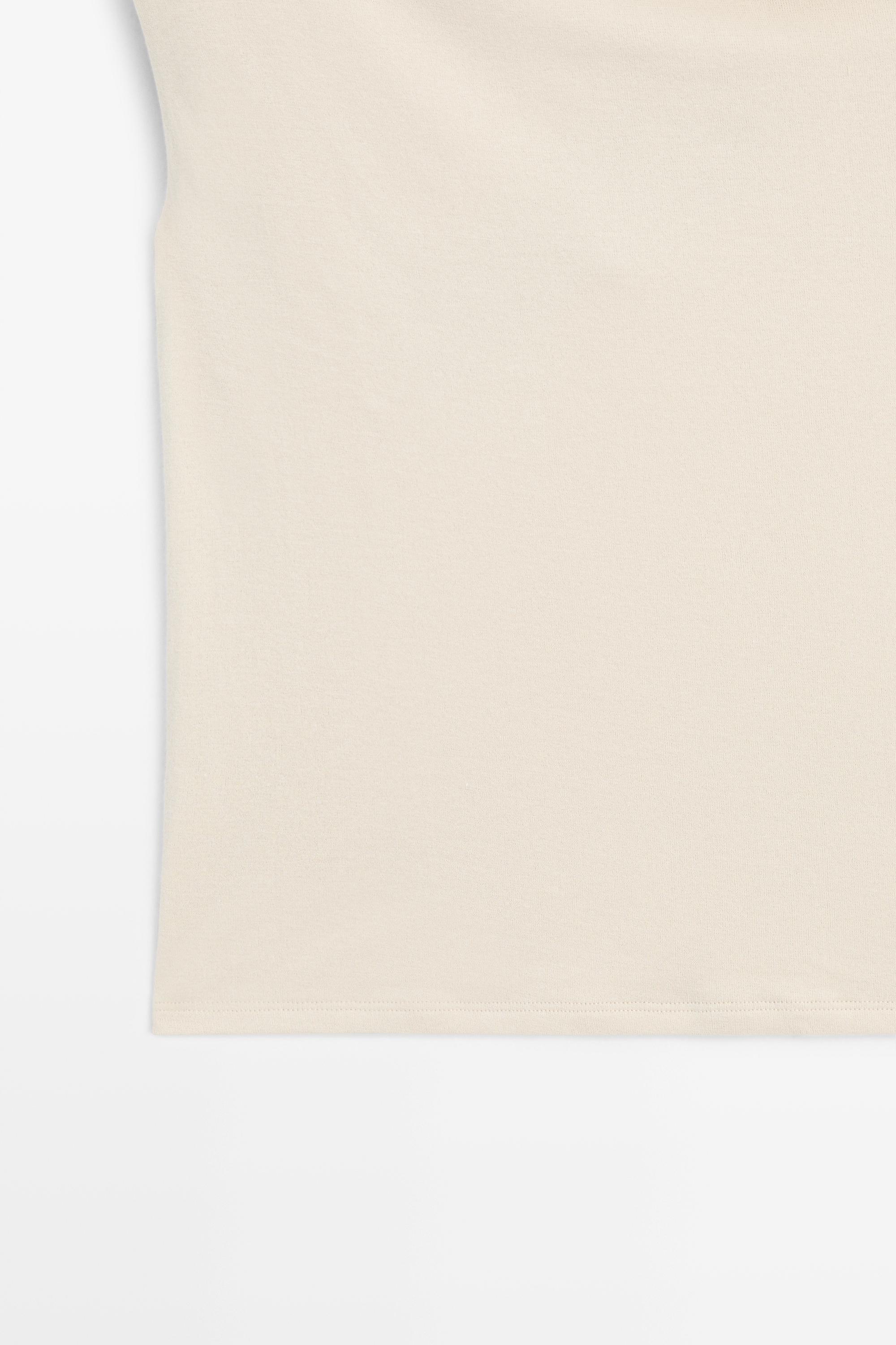 Asymmetric drop sleeve top — SAND