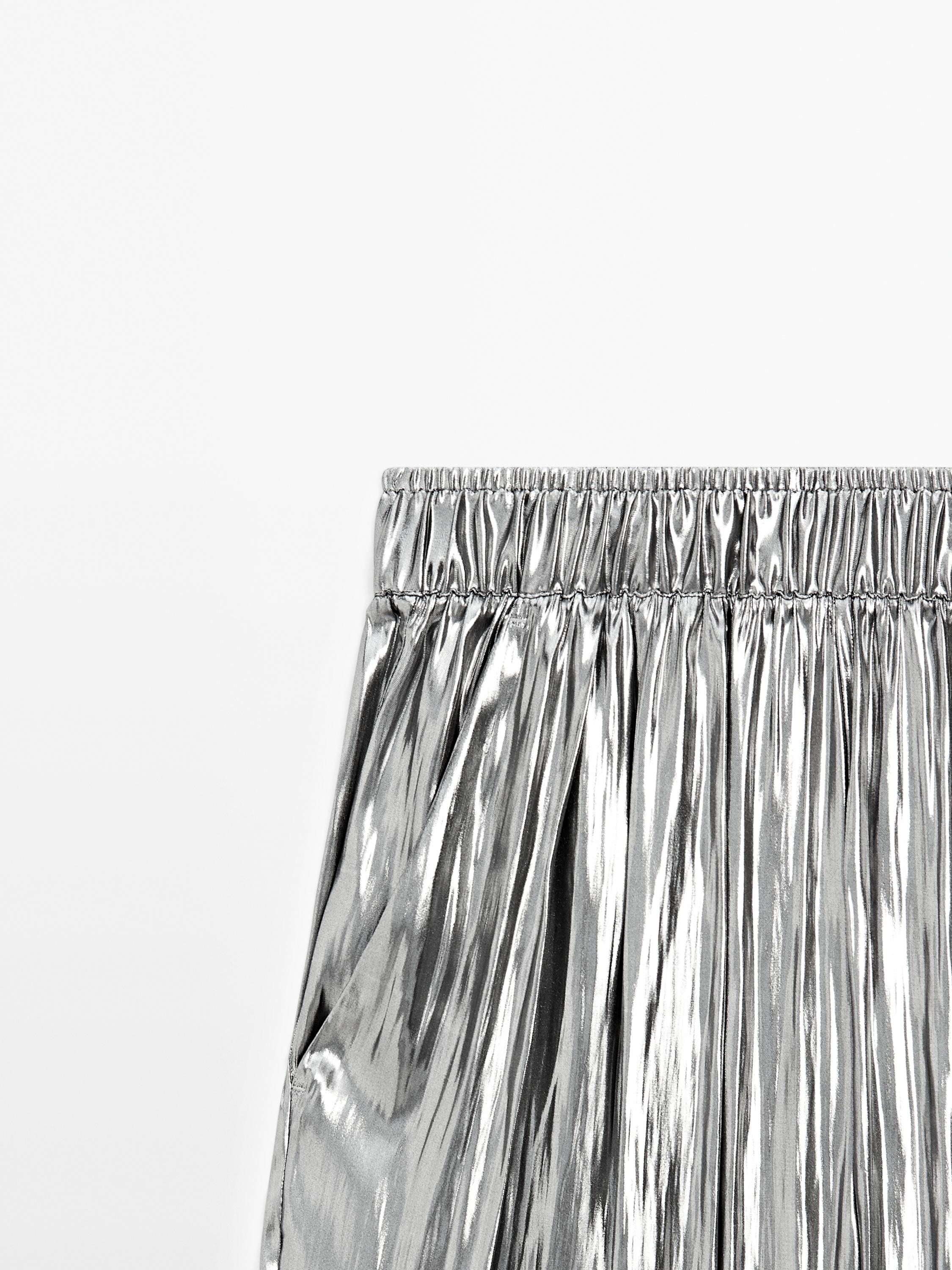 Flowing metallic trousers with gathered detail