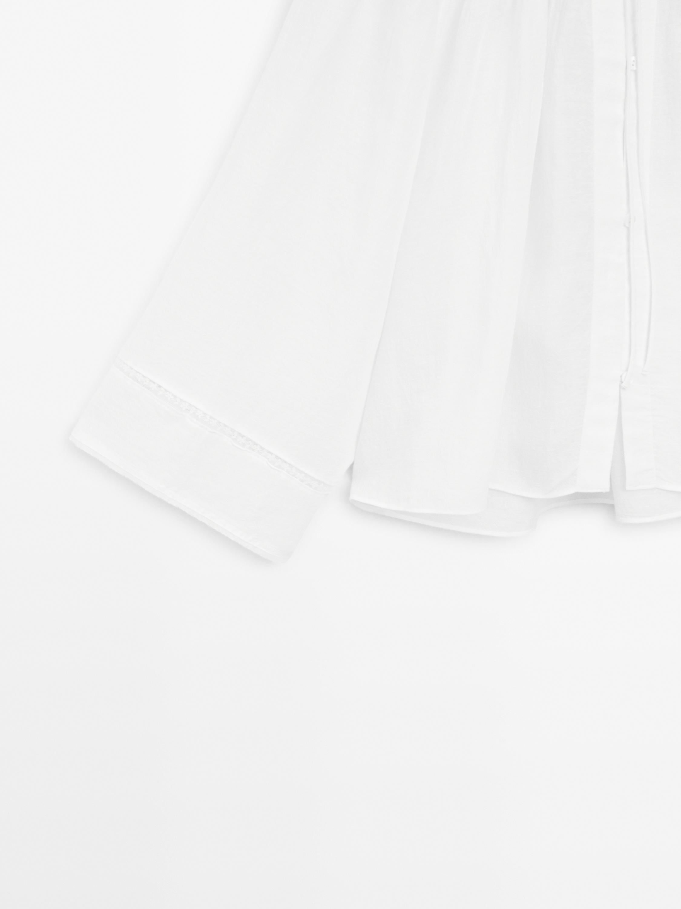 Flowing blouse with lace detail
