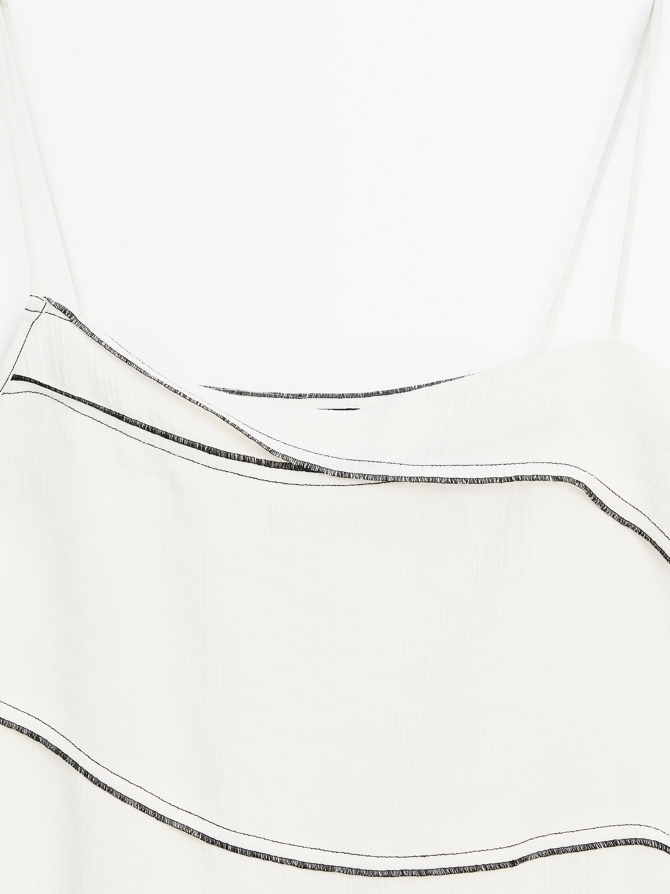 Flowing top with topstitching detail