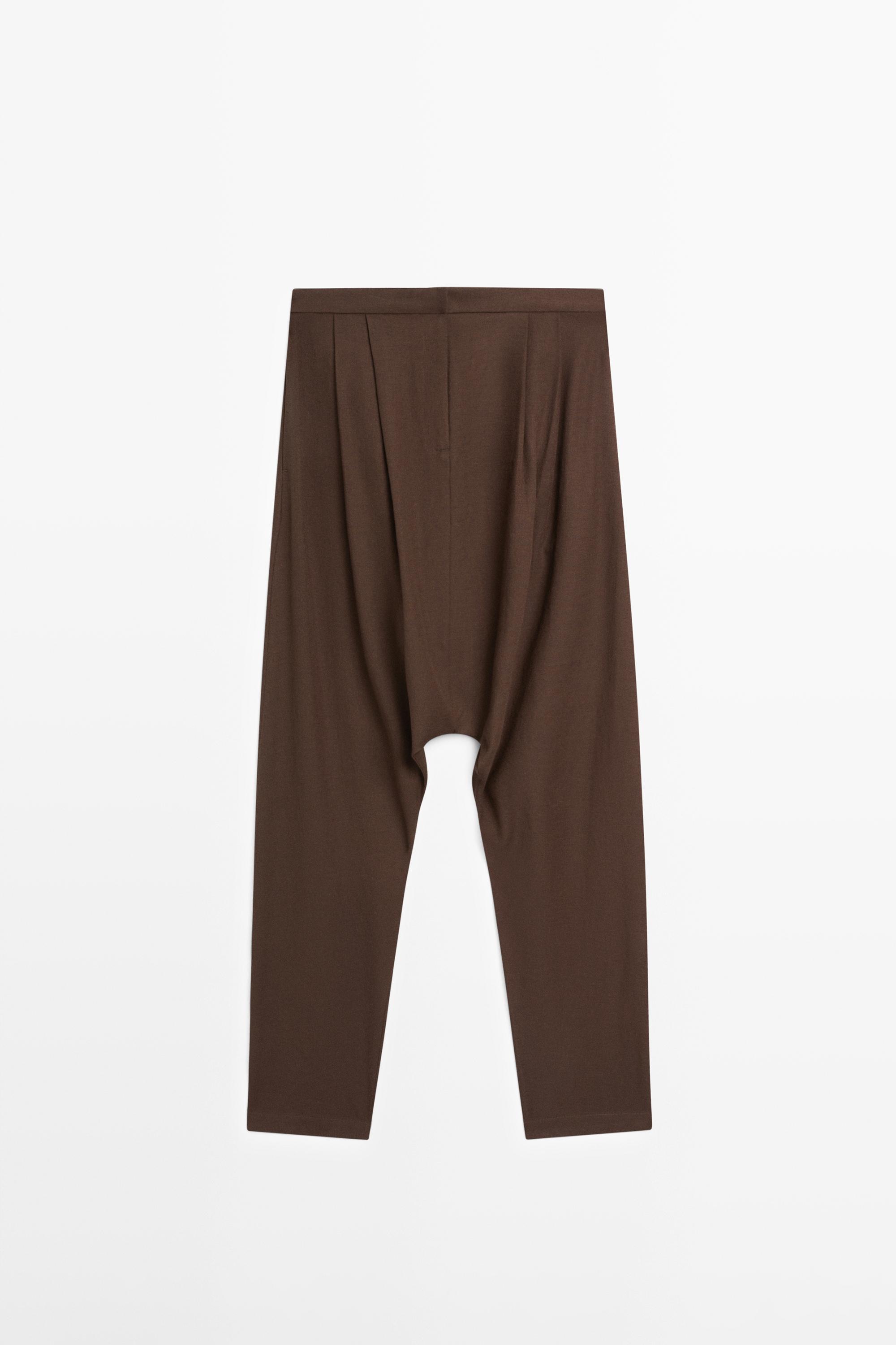 Baggy trousers with pleated details — BROWN