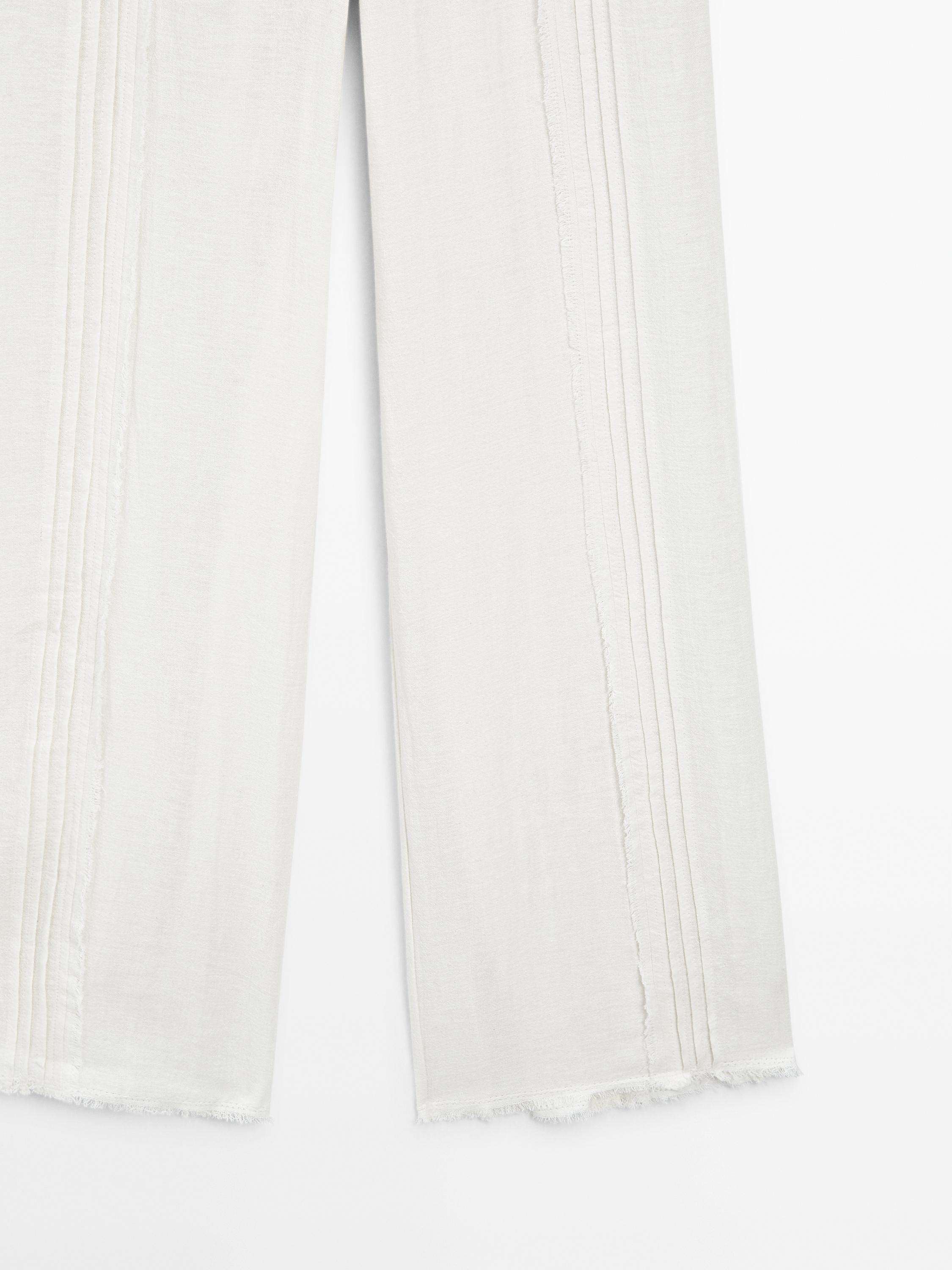 Cotton blend trousers with embroidered details