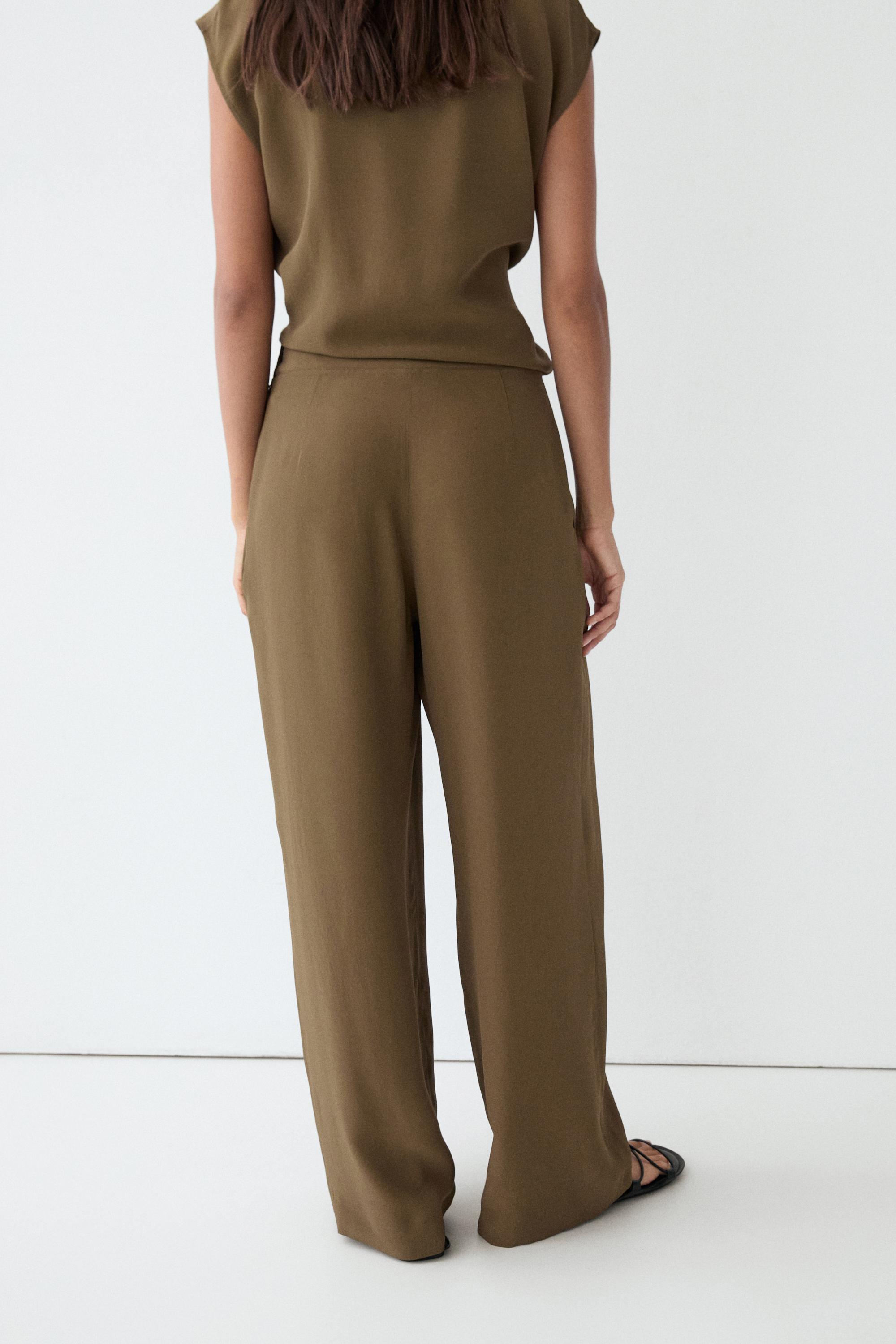 Total look flowing trousers with box pleats — MOSS GREEN