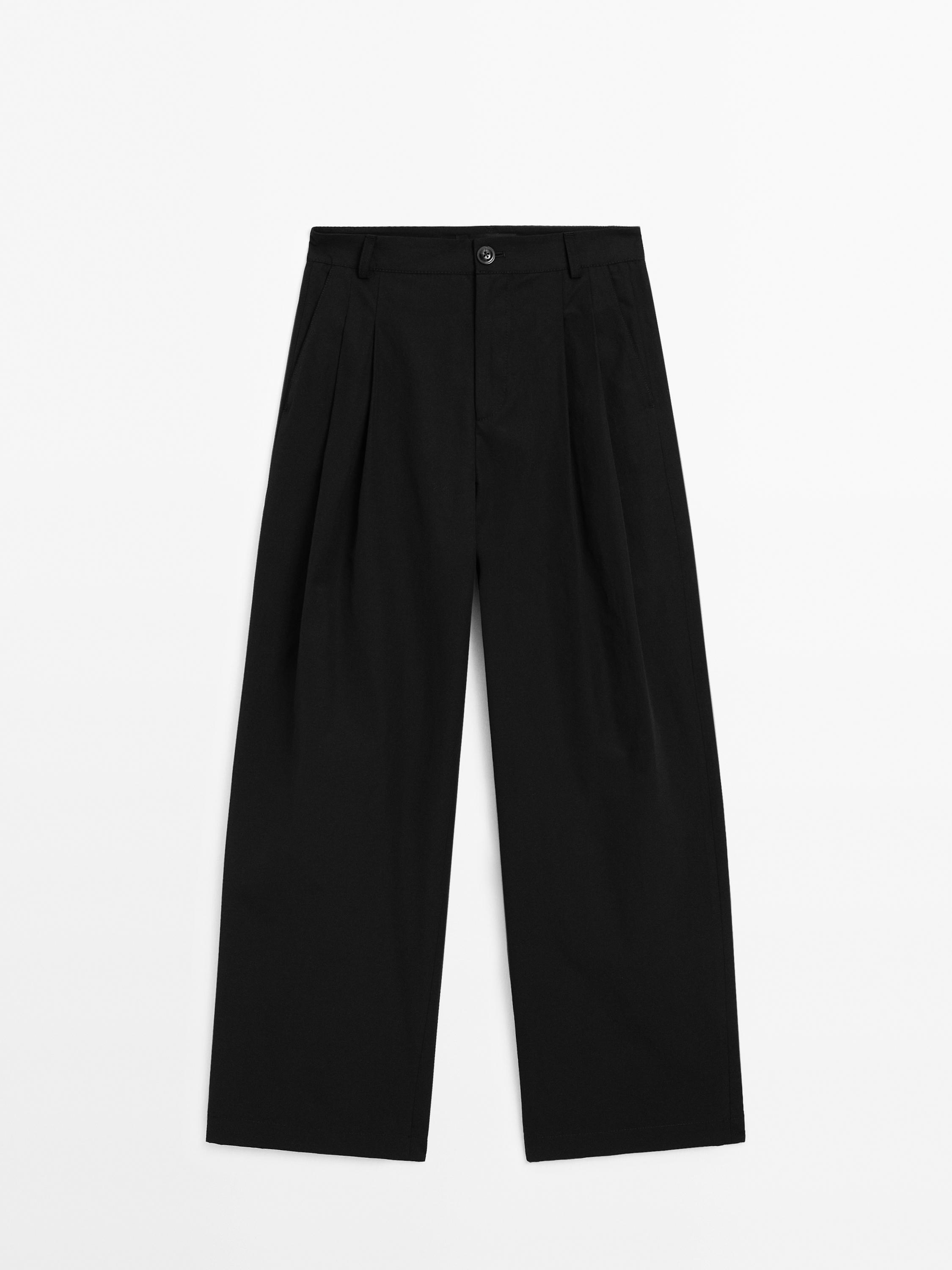 Wide-leg pleated cotton blend trousers