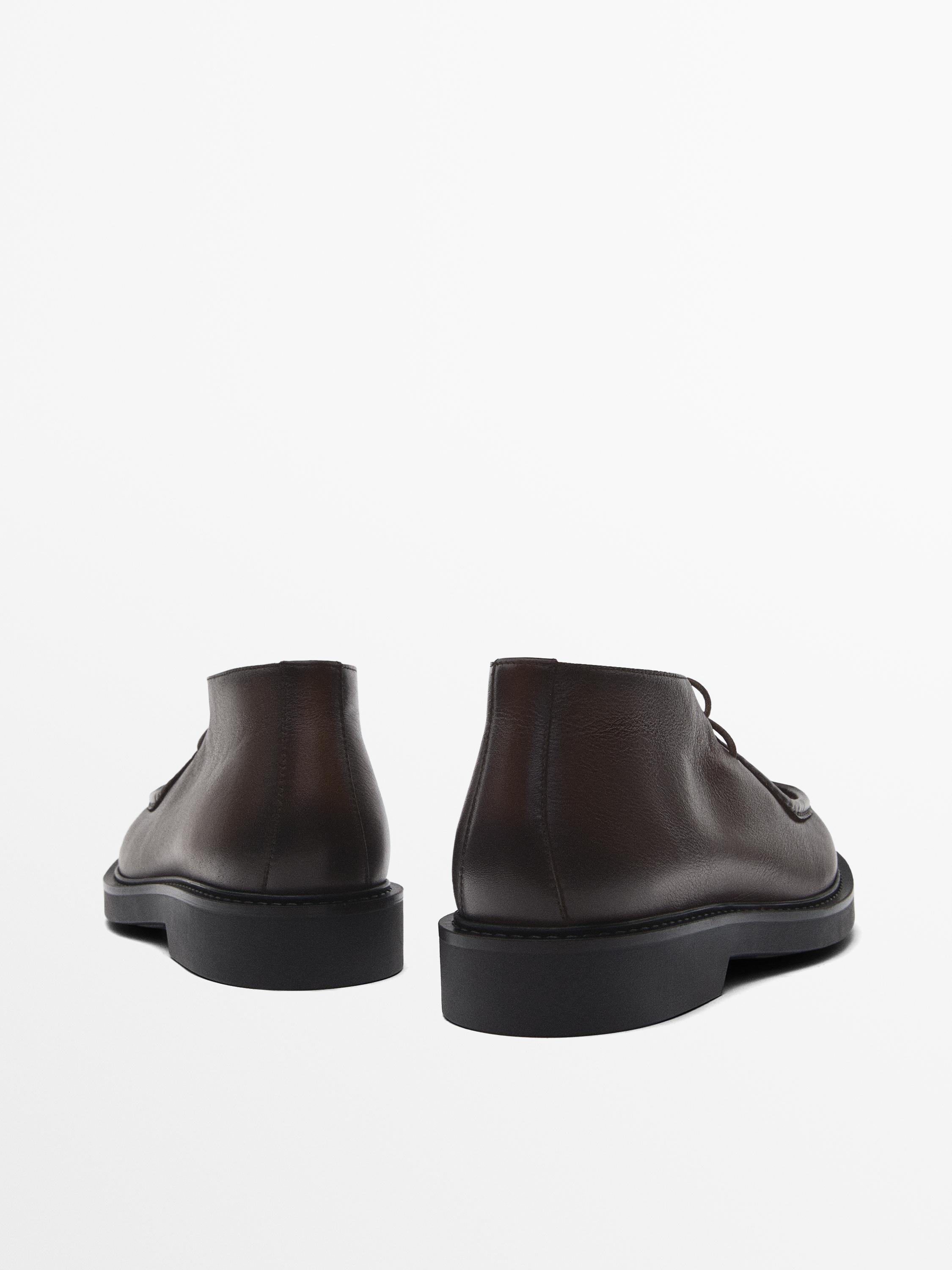 Bottines avec ganse en cuir