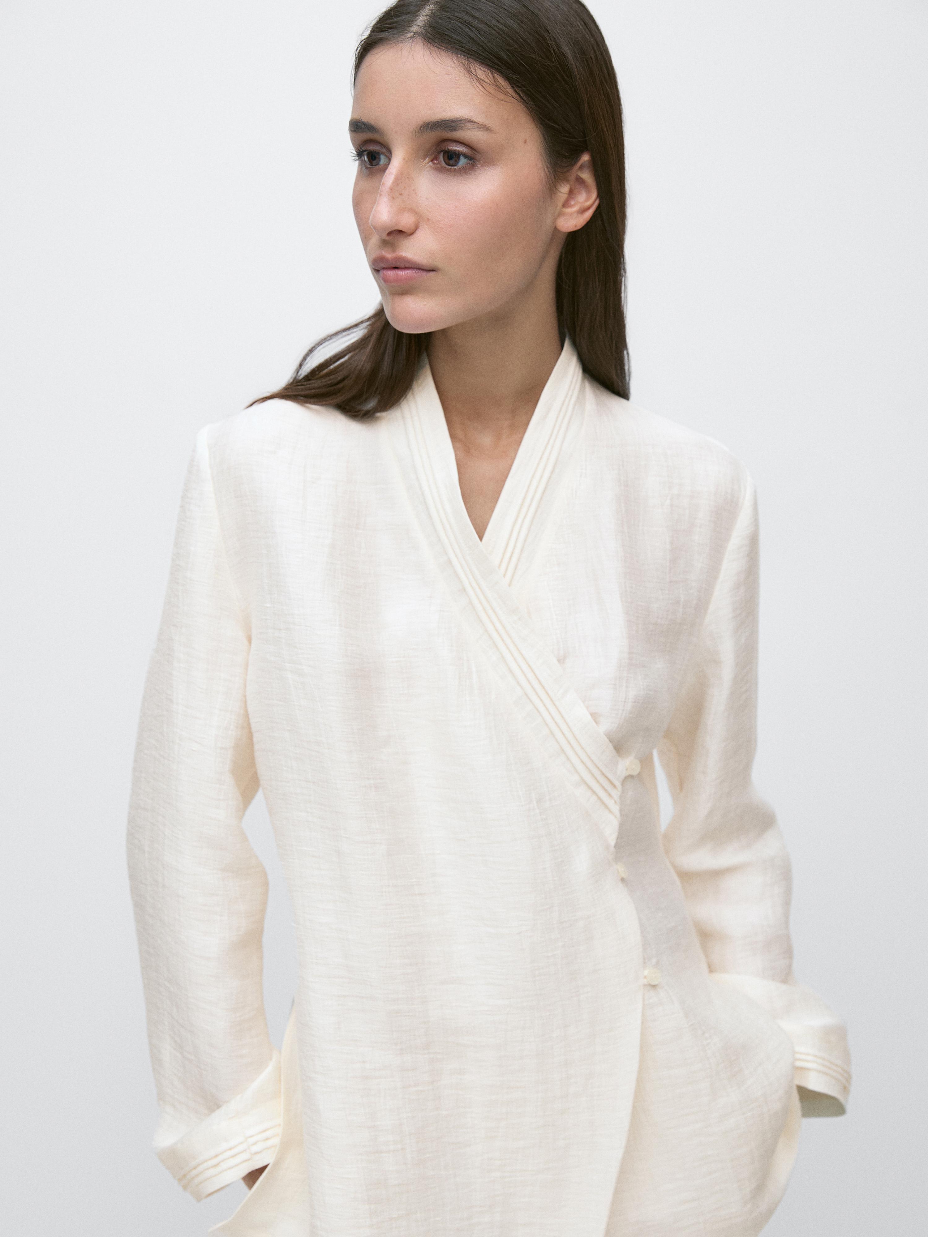 "Medium shot of a kimono with a wrap collar and long sleeves."