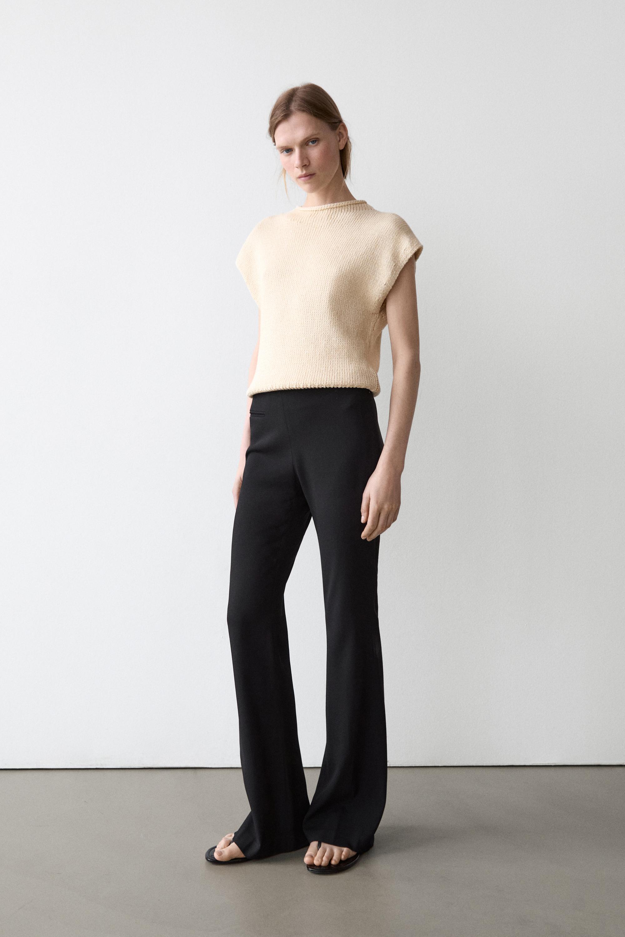 Flared trousers with pocket — BLACK