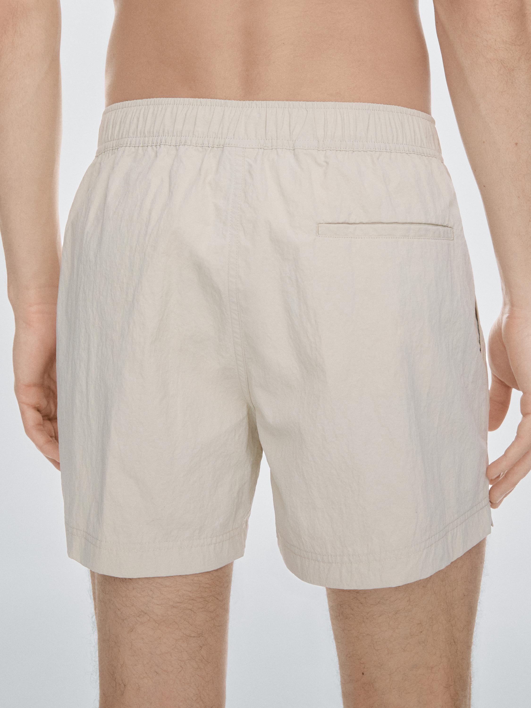 Plain swimming trunks with waist detail — SAND