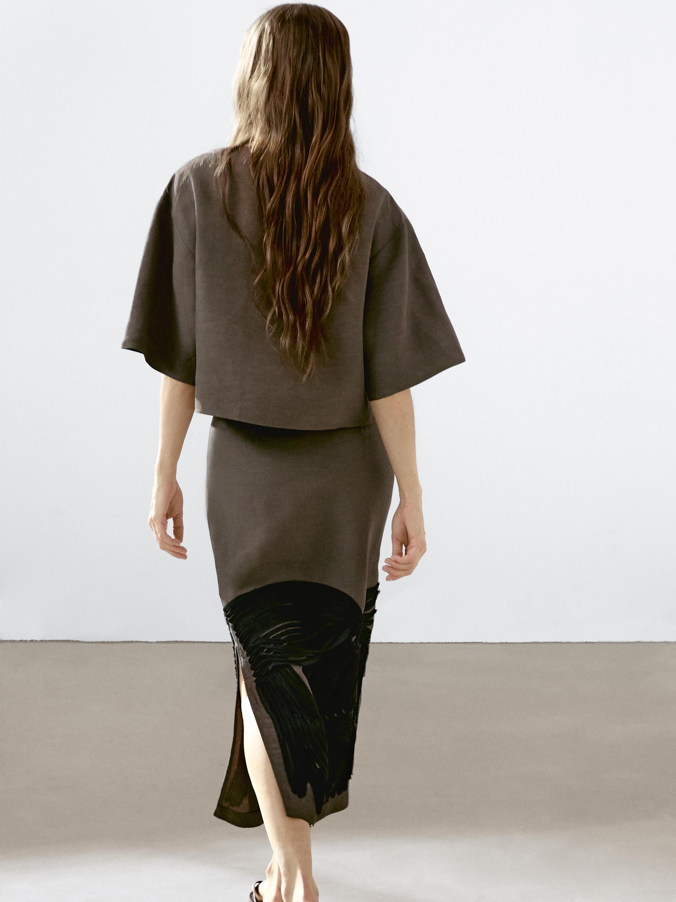 Flowing blouse with contrasting ribbons