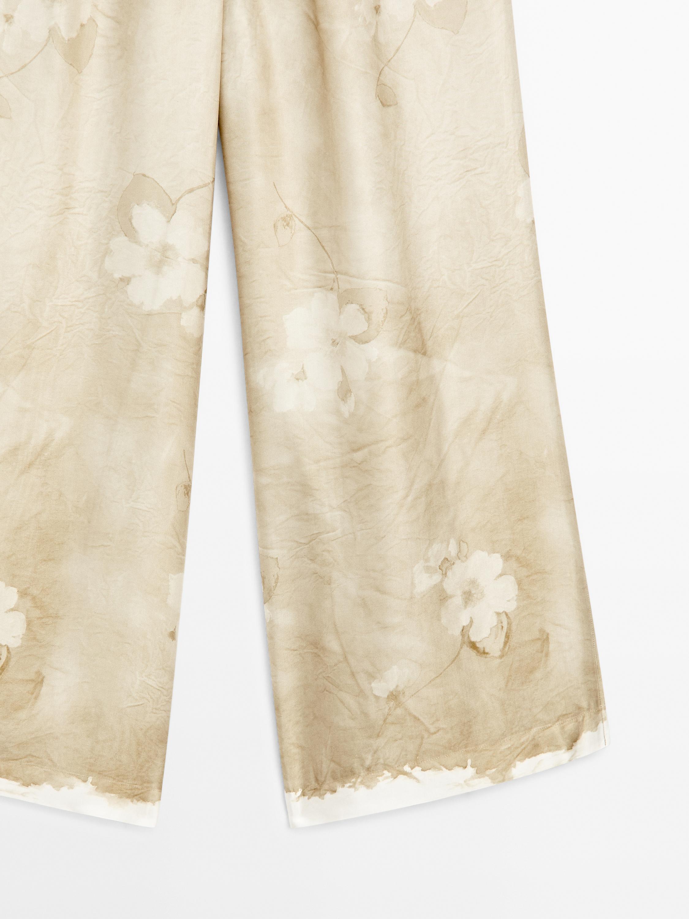 Flowing printed trousers with drawstring detail