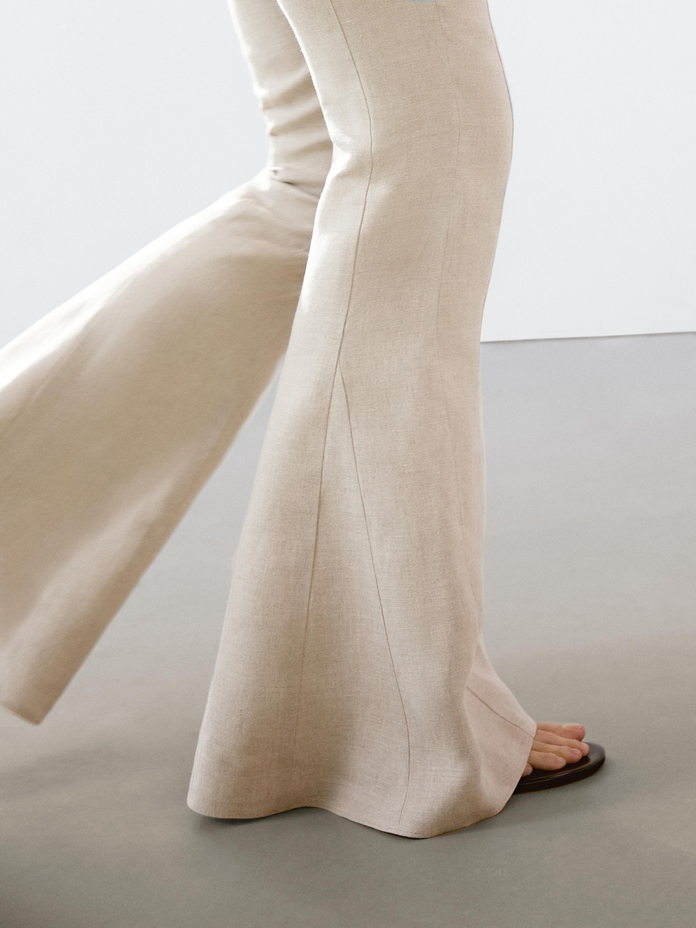 Flared trousers with contrast waist