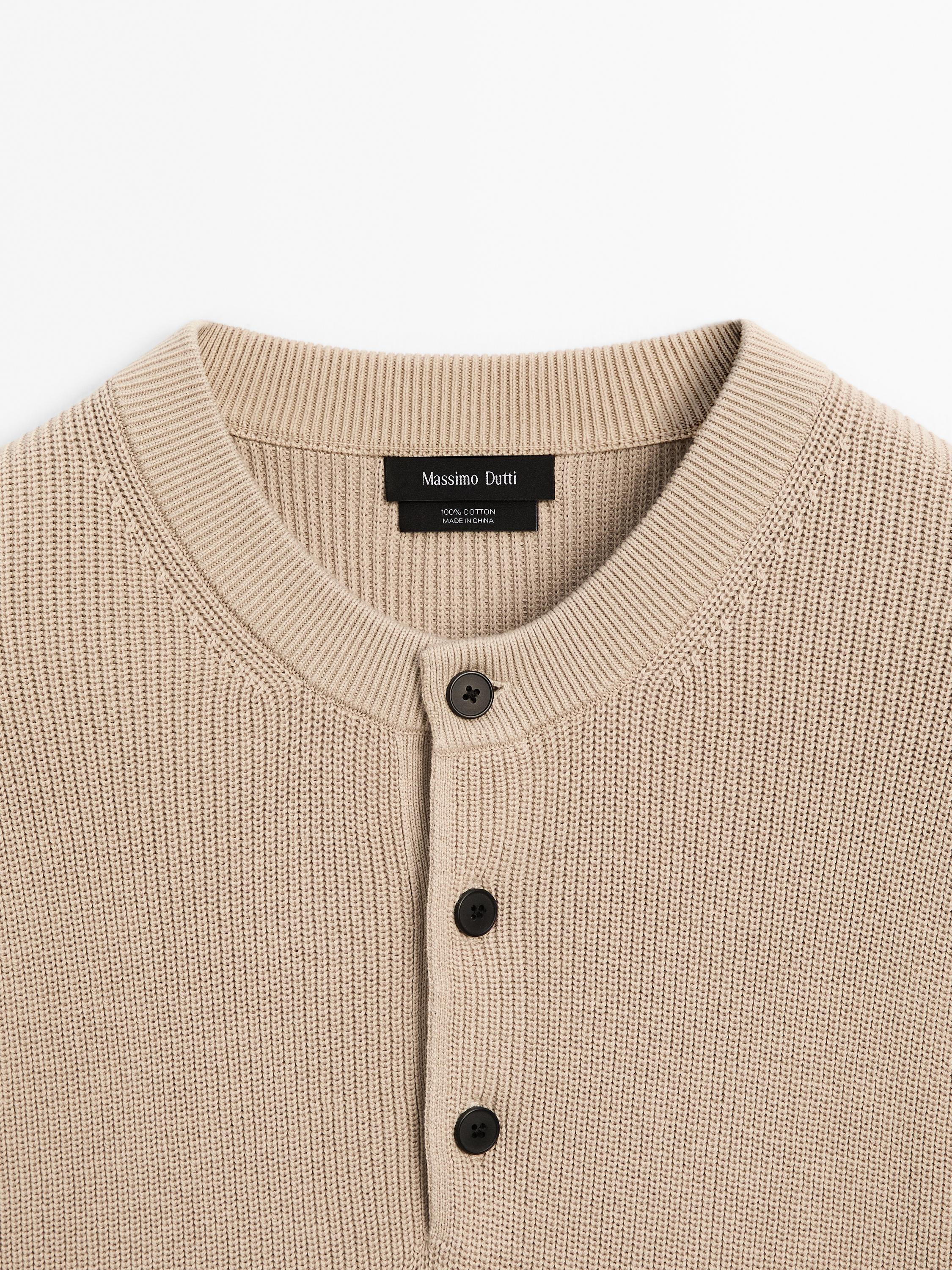 Cotton knit sweater with buttoned neck
