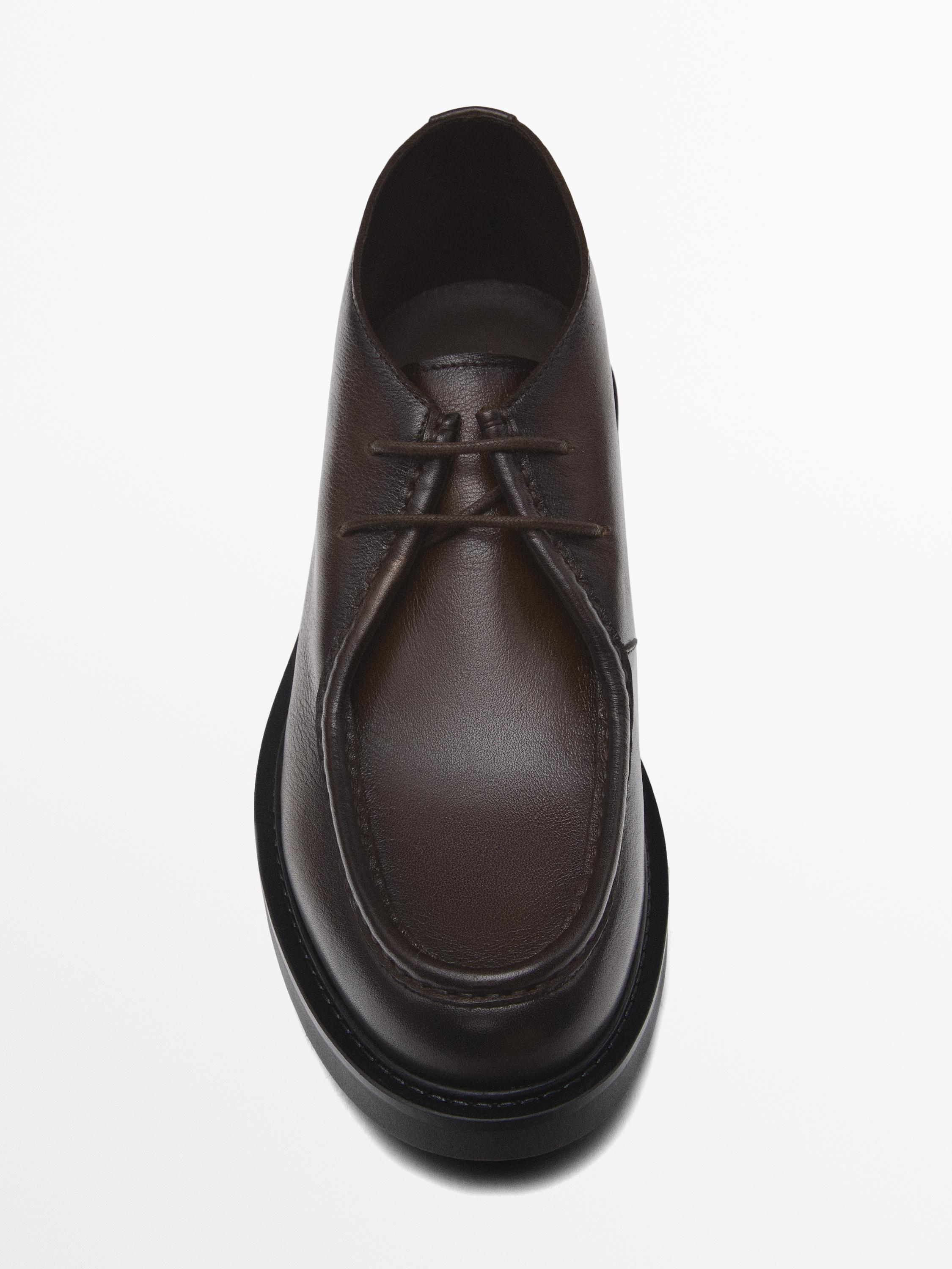 Bottines avec ganse en cuir