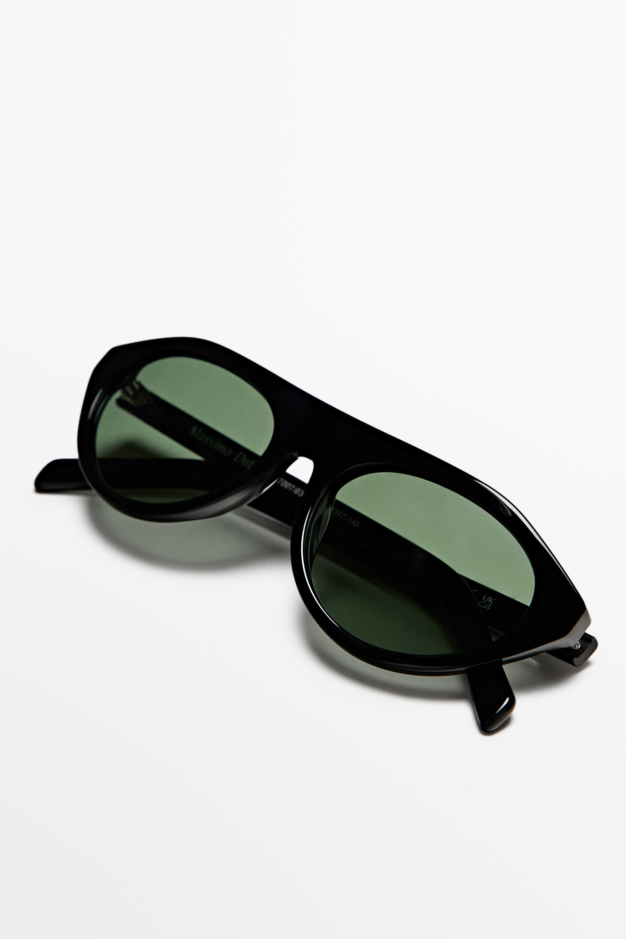 Oval sunglasses — BLACK