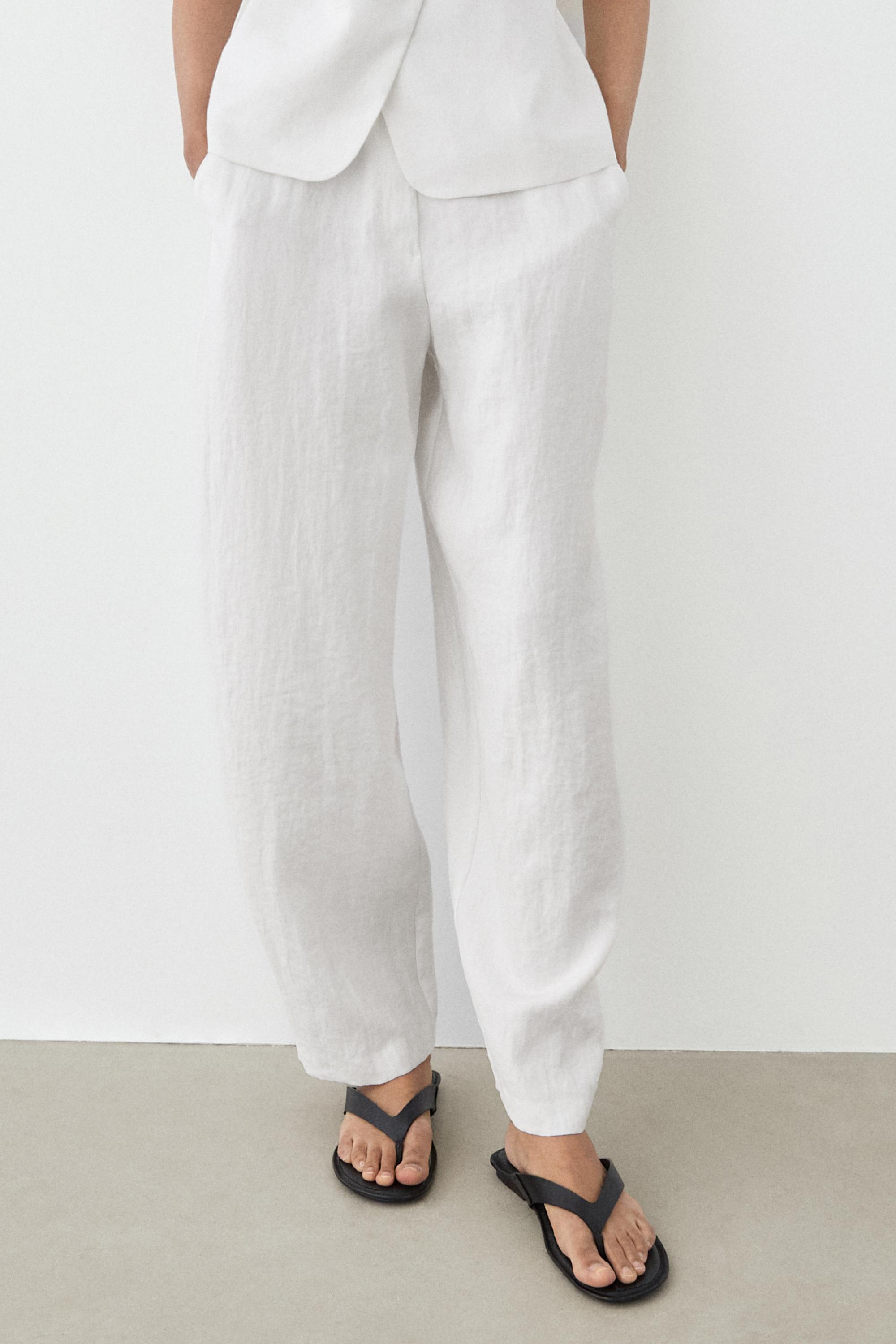 Flowing trousers with buckles — WHITE