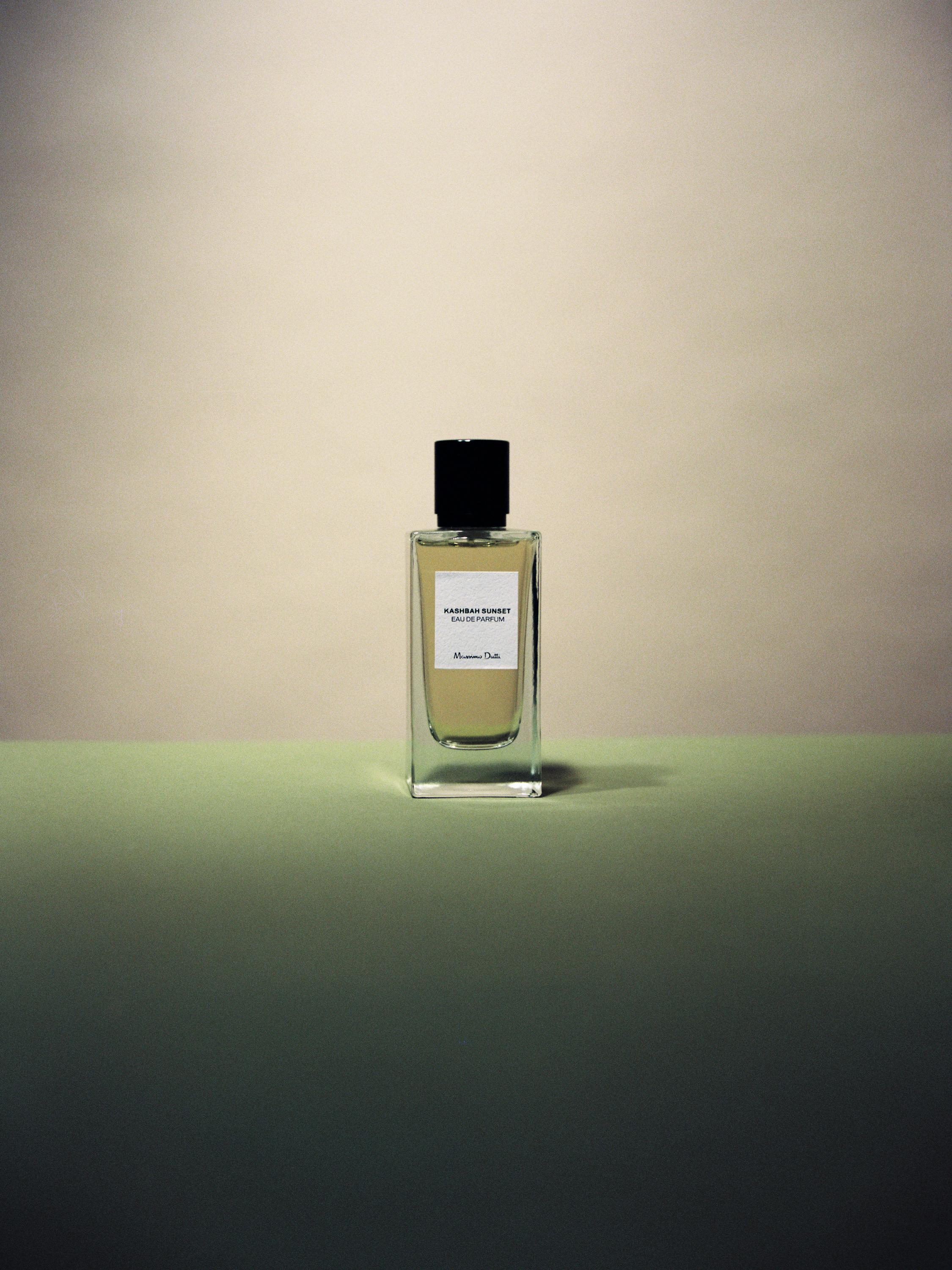 Brown perfume bottle with text "Kashbah Sunset Eau de Parfum" on the front label.