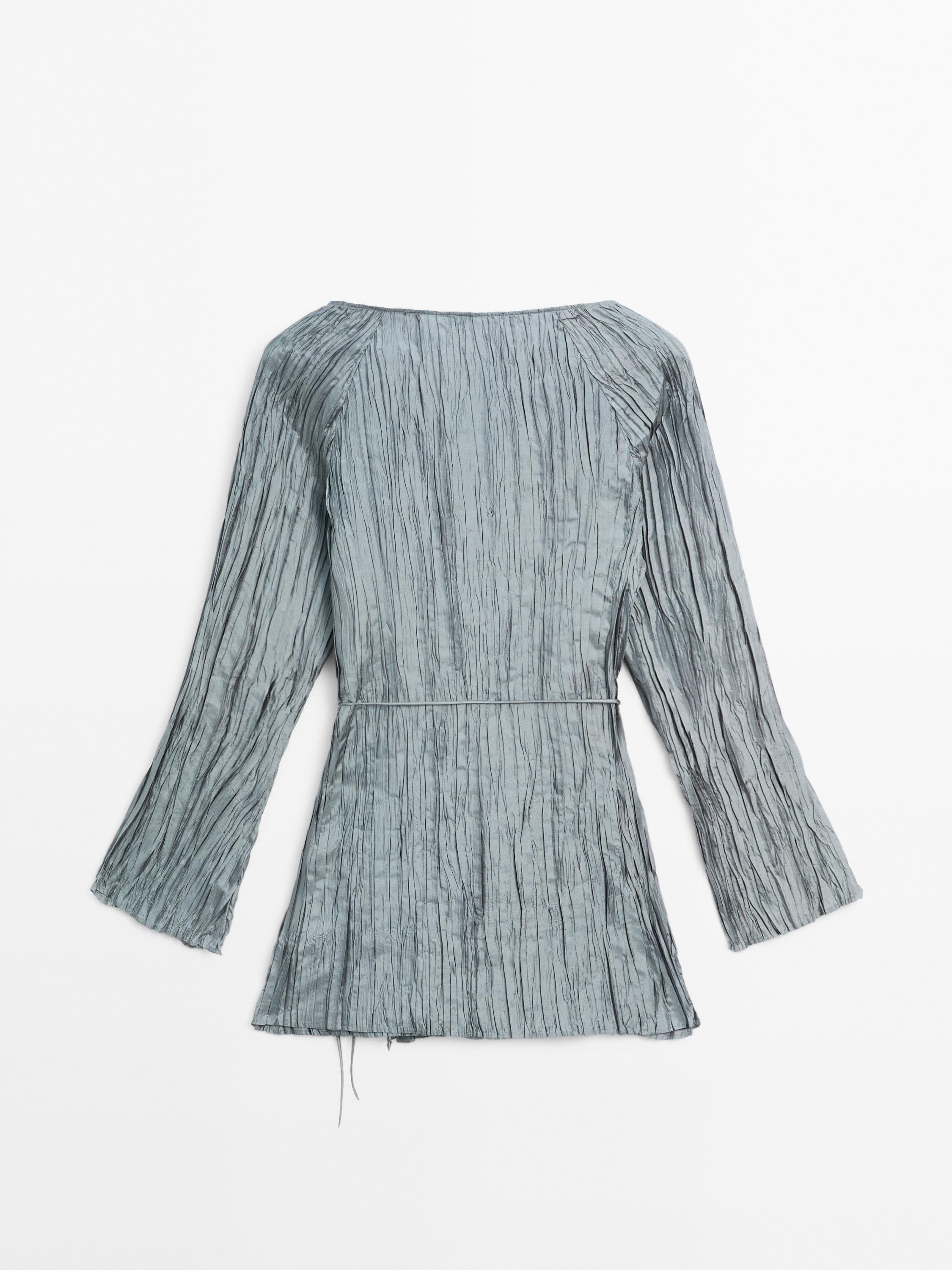 Long sleeve top with crossover fastening
