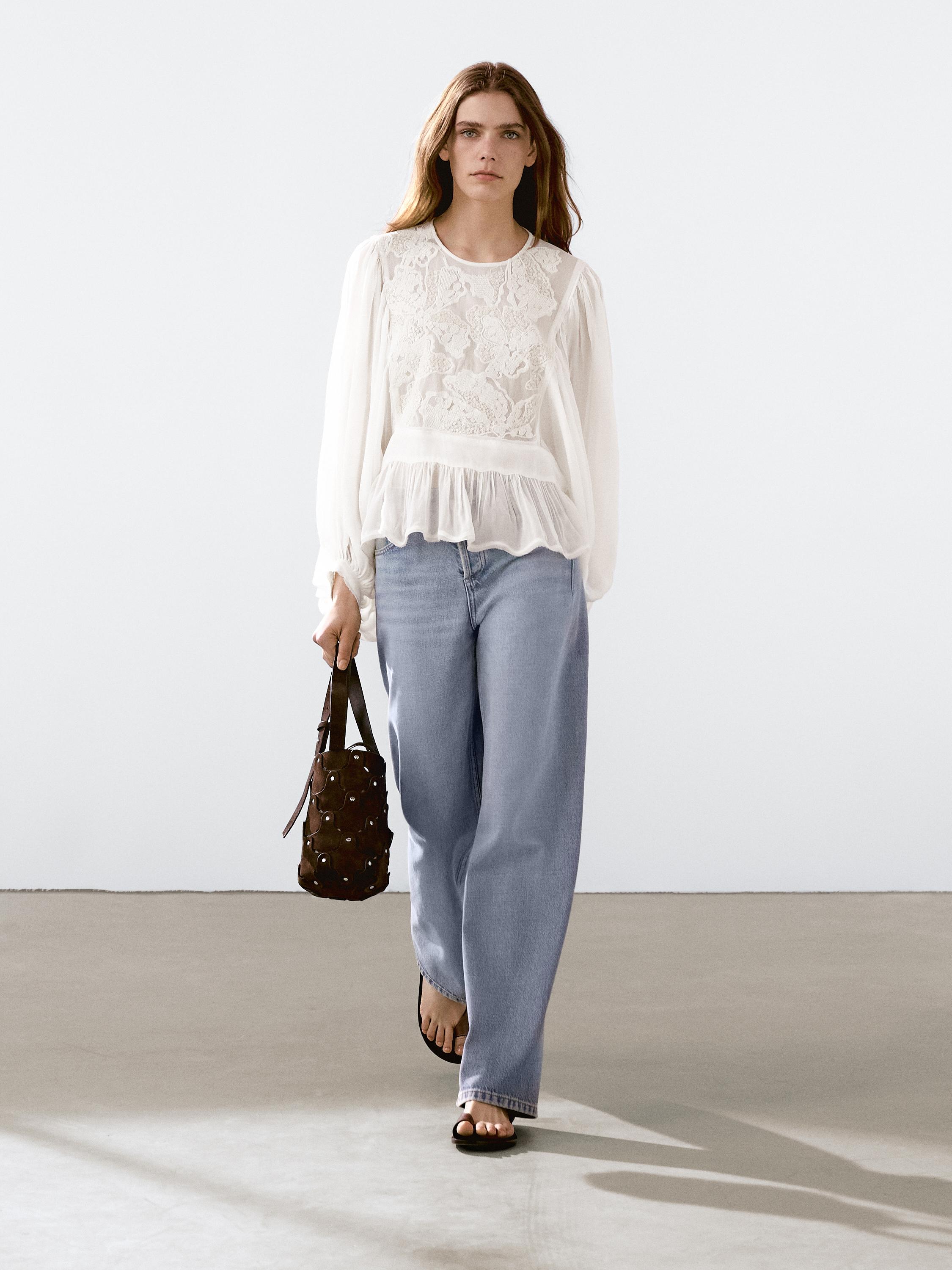 Flowing embroidered peplum blouse