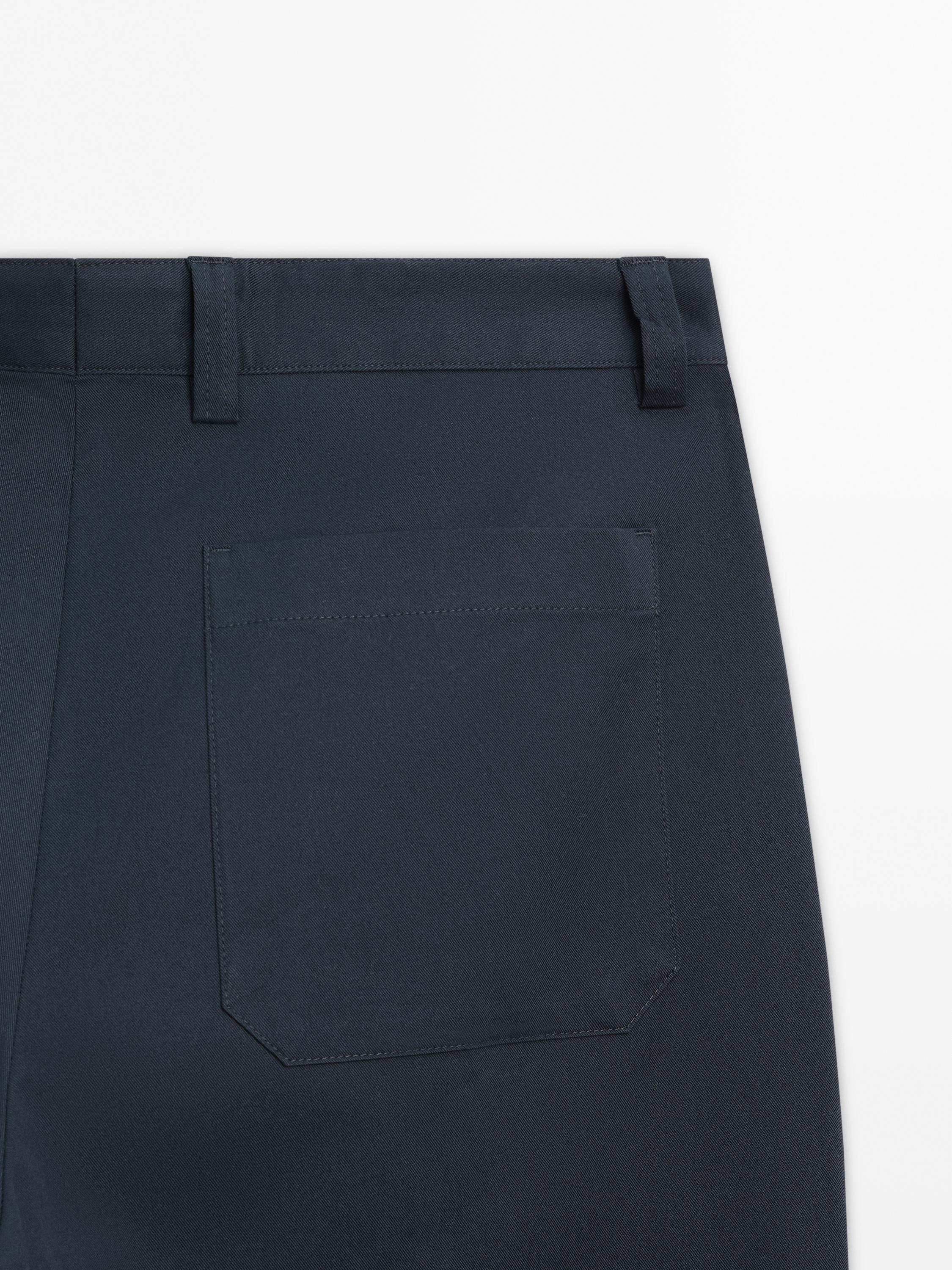 Slim fit cotton blend trousers.