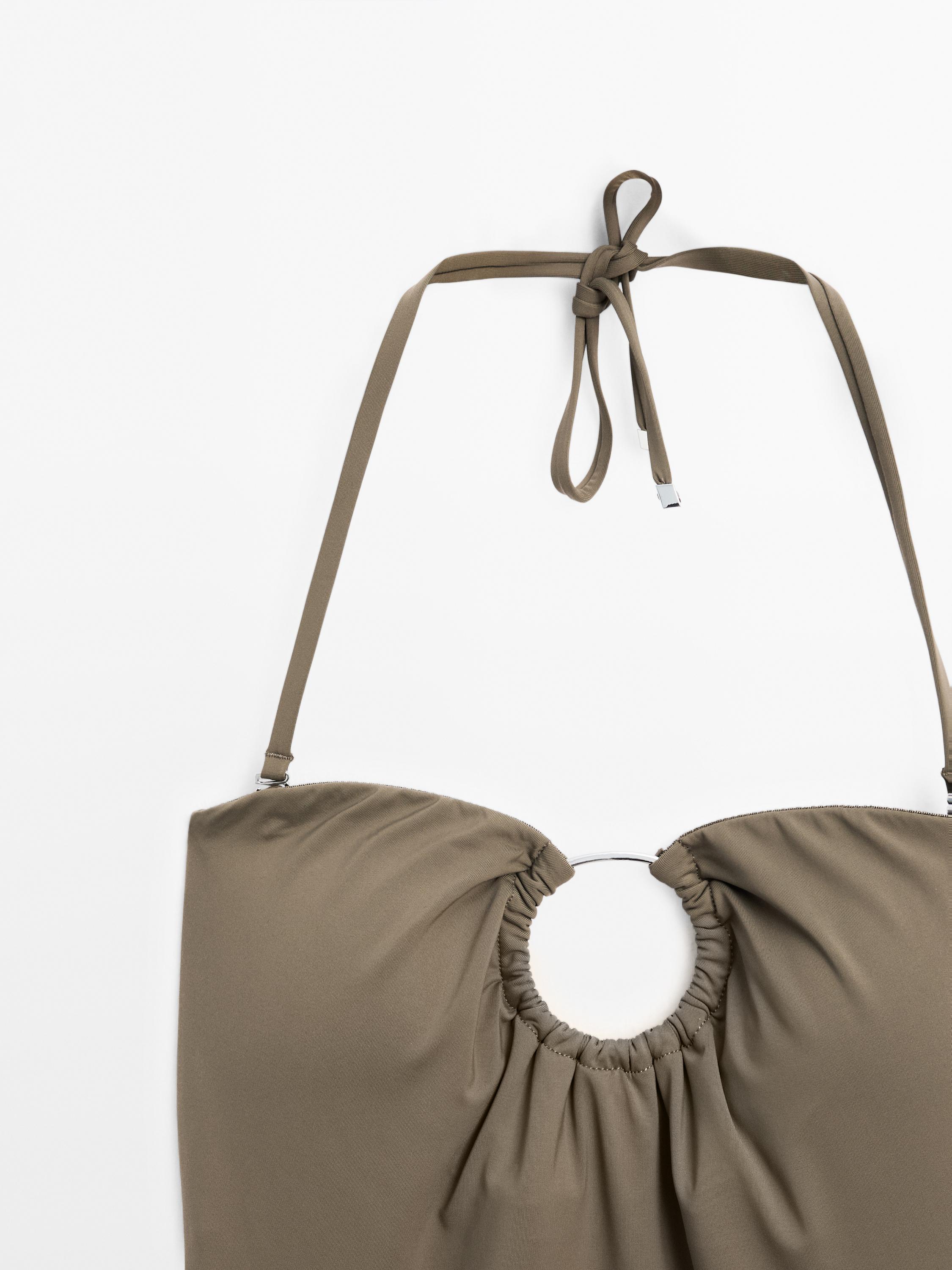 Bandeau swimsuit with metal piece detail