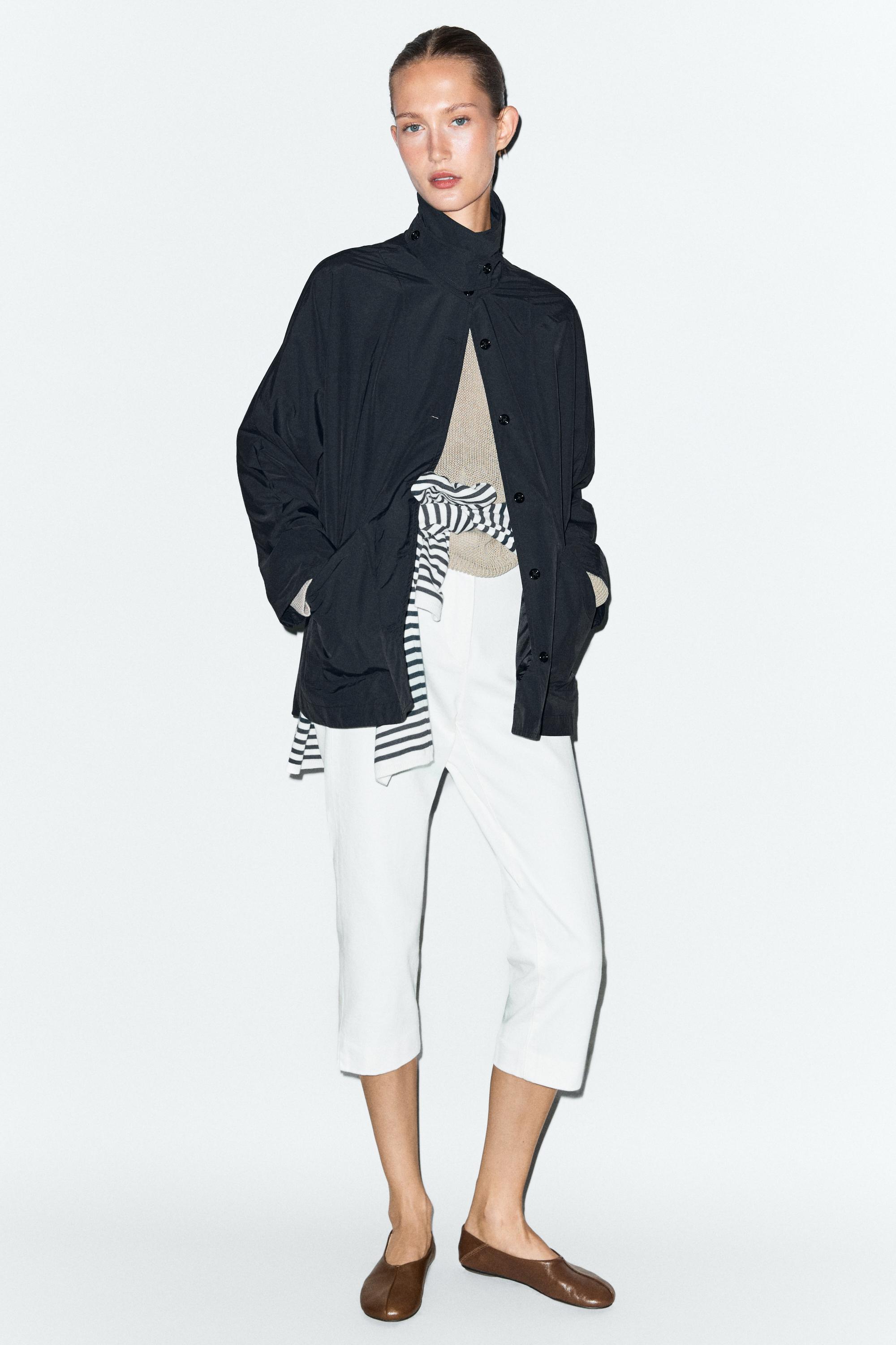 Jacket with buttoned collar strap