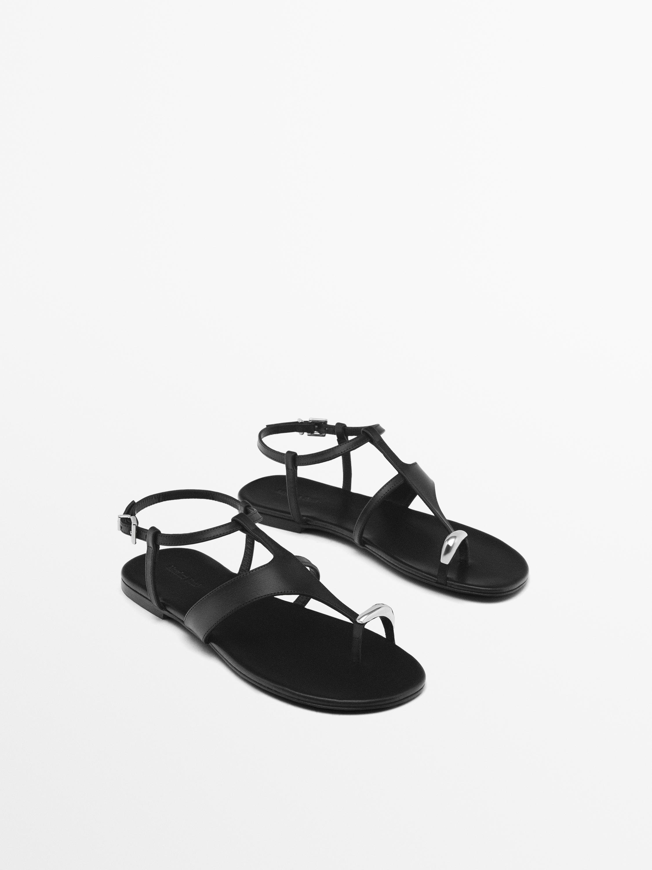 Flat sandals with metallic embellishment
