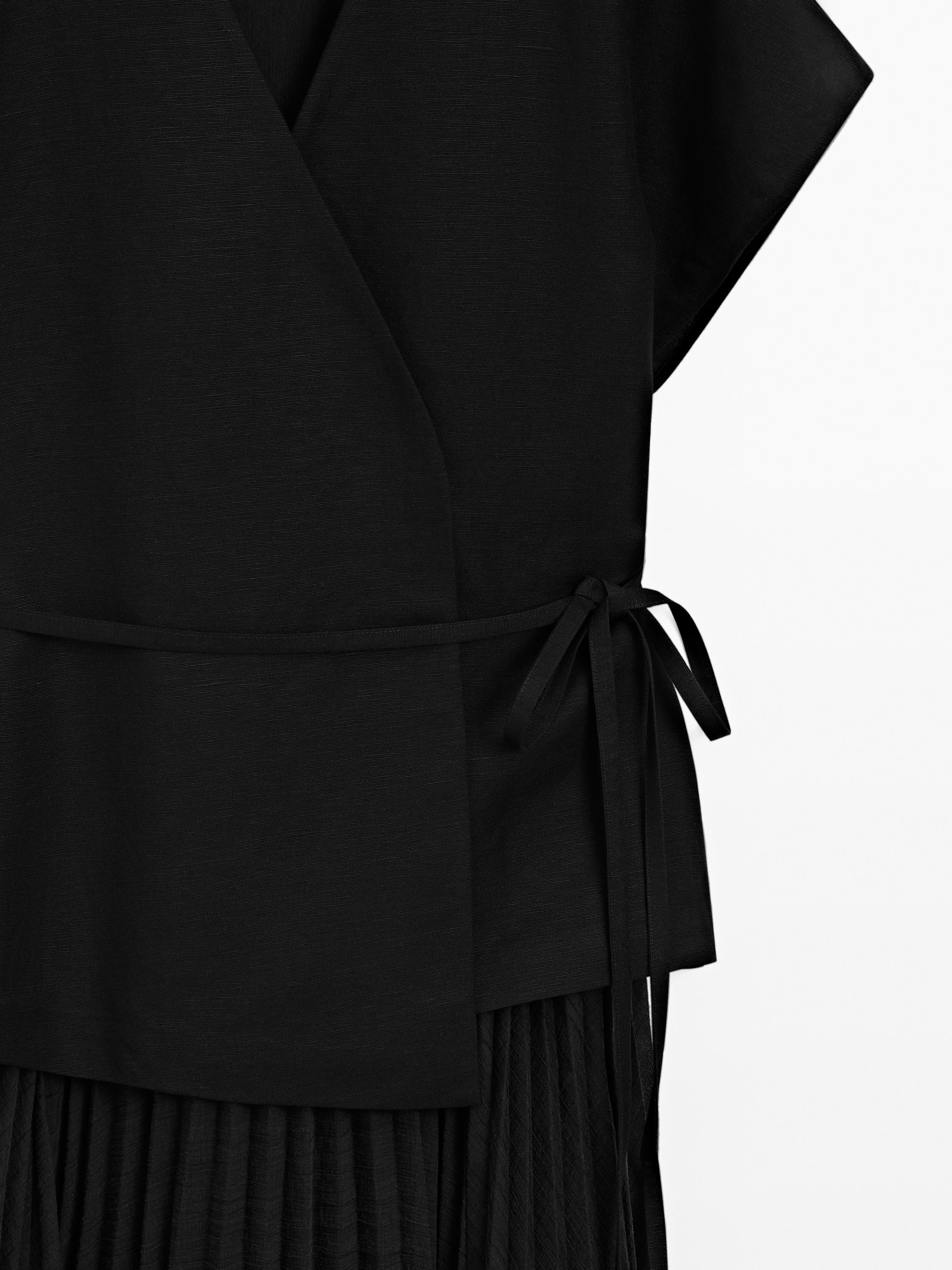 Long pleated dress with waistcoat detail