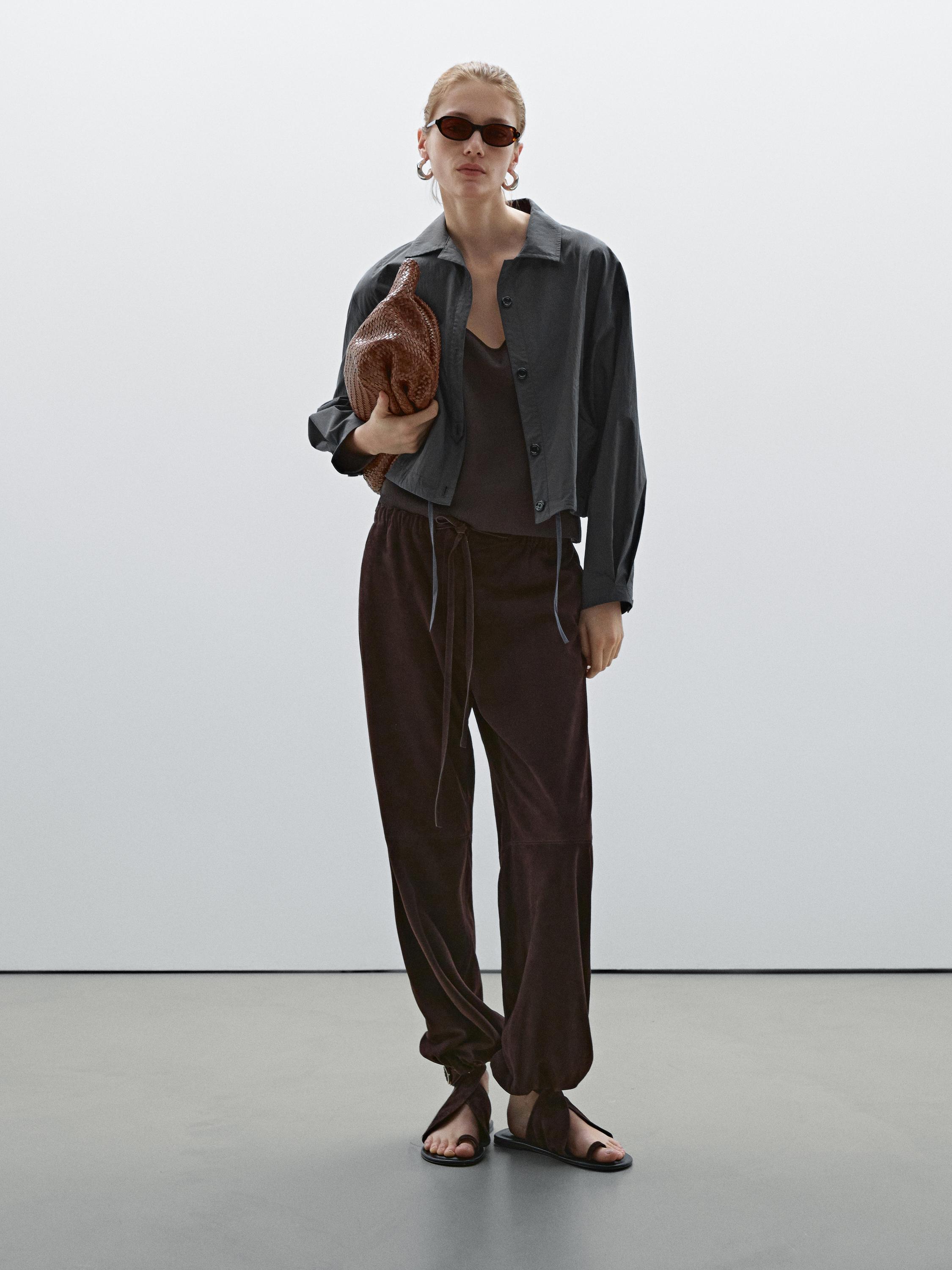 Bomber jacket with seams and gathering