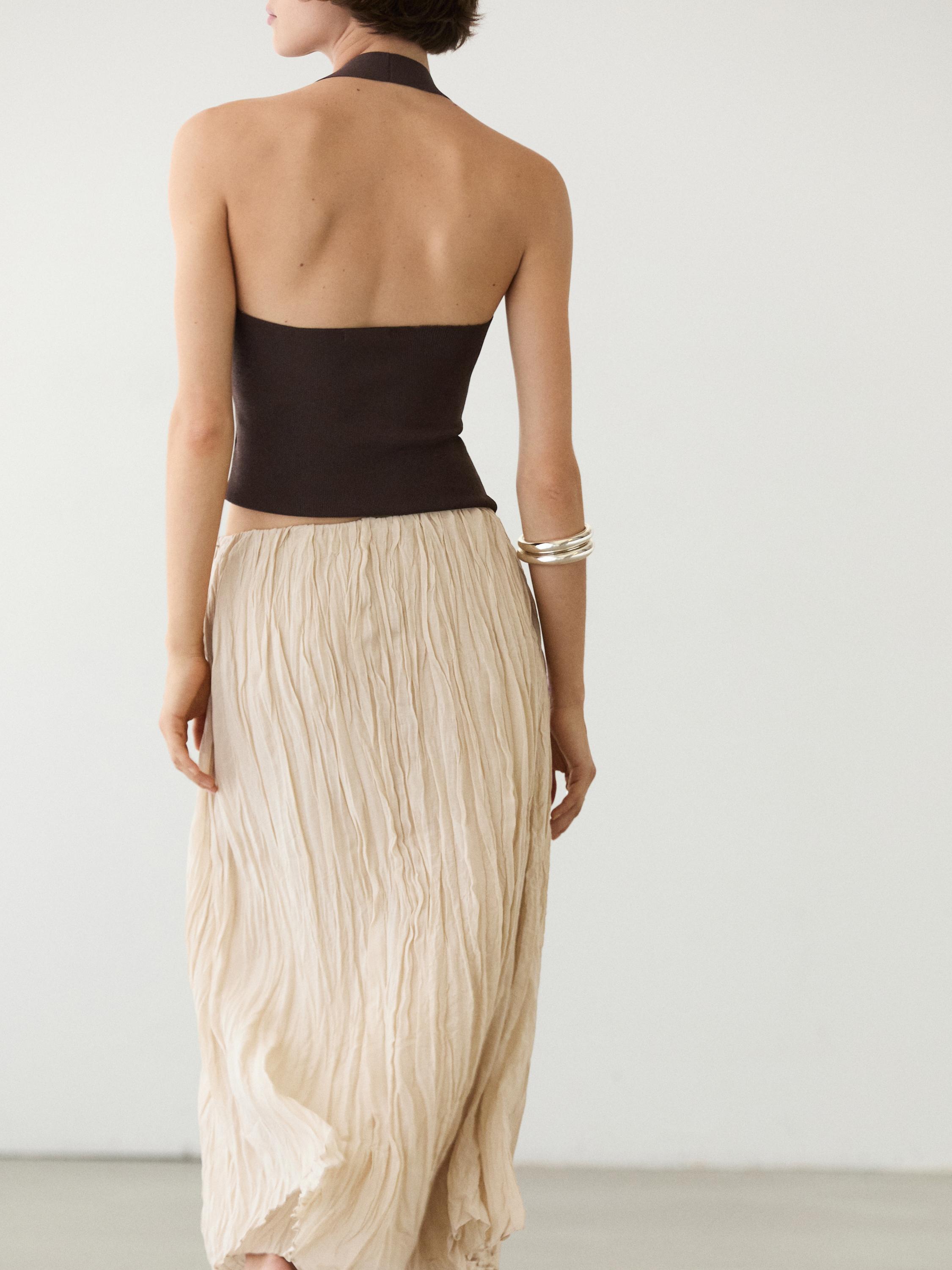 Flowing midi skirt with pleated detail — CREAM