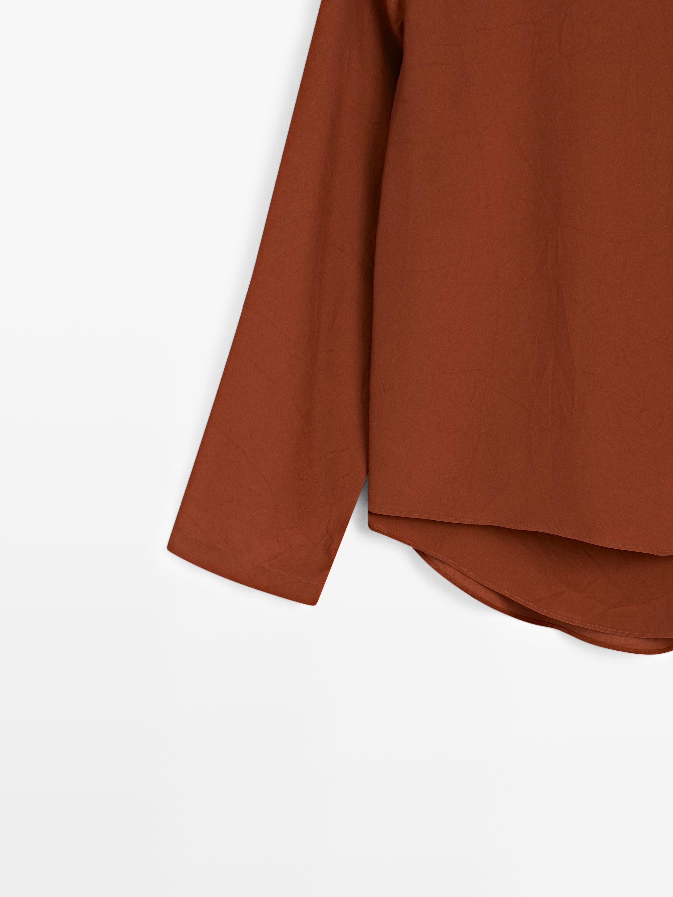 Flowing blouse with tied neck