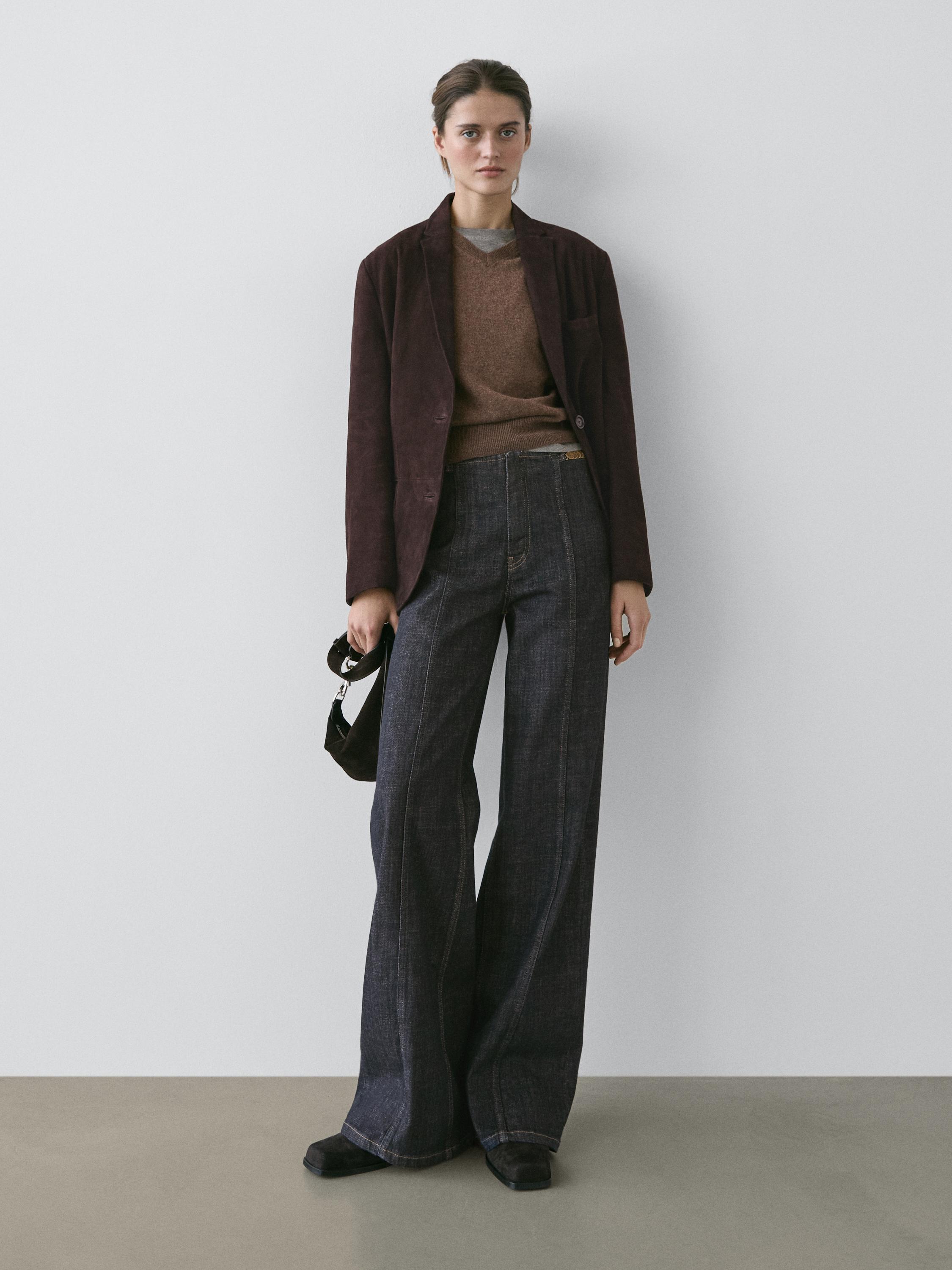 High-waist wide-leg jeans with chains