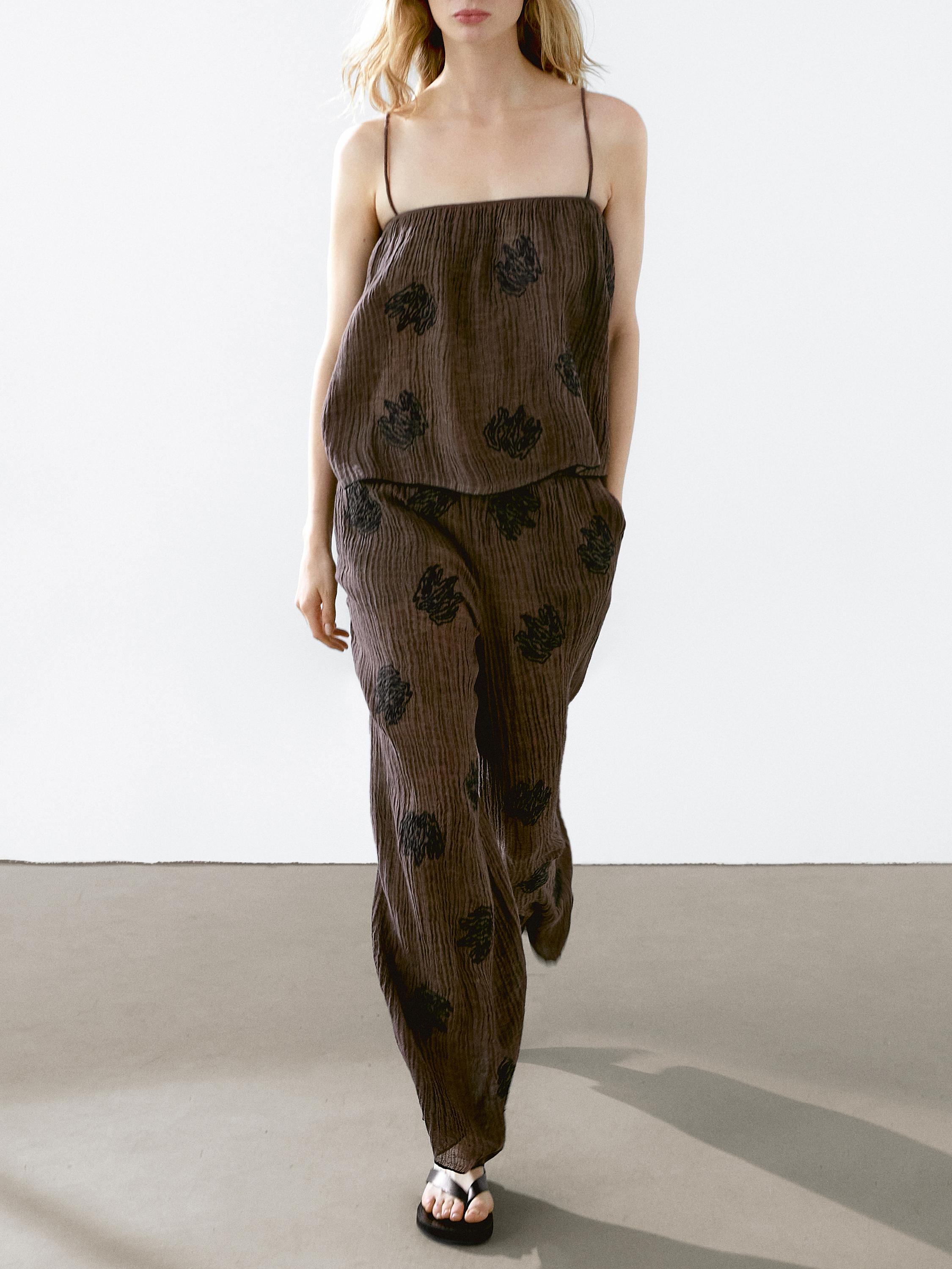 Flowing textured top with embroidered detail