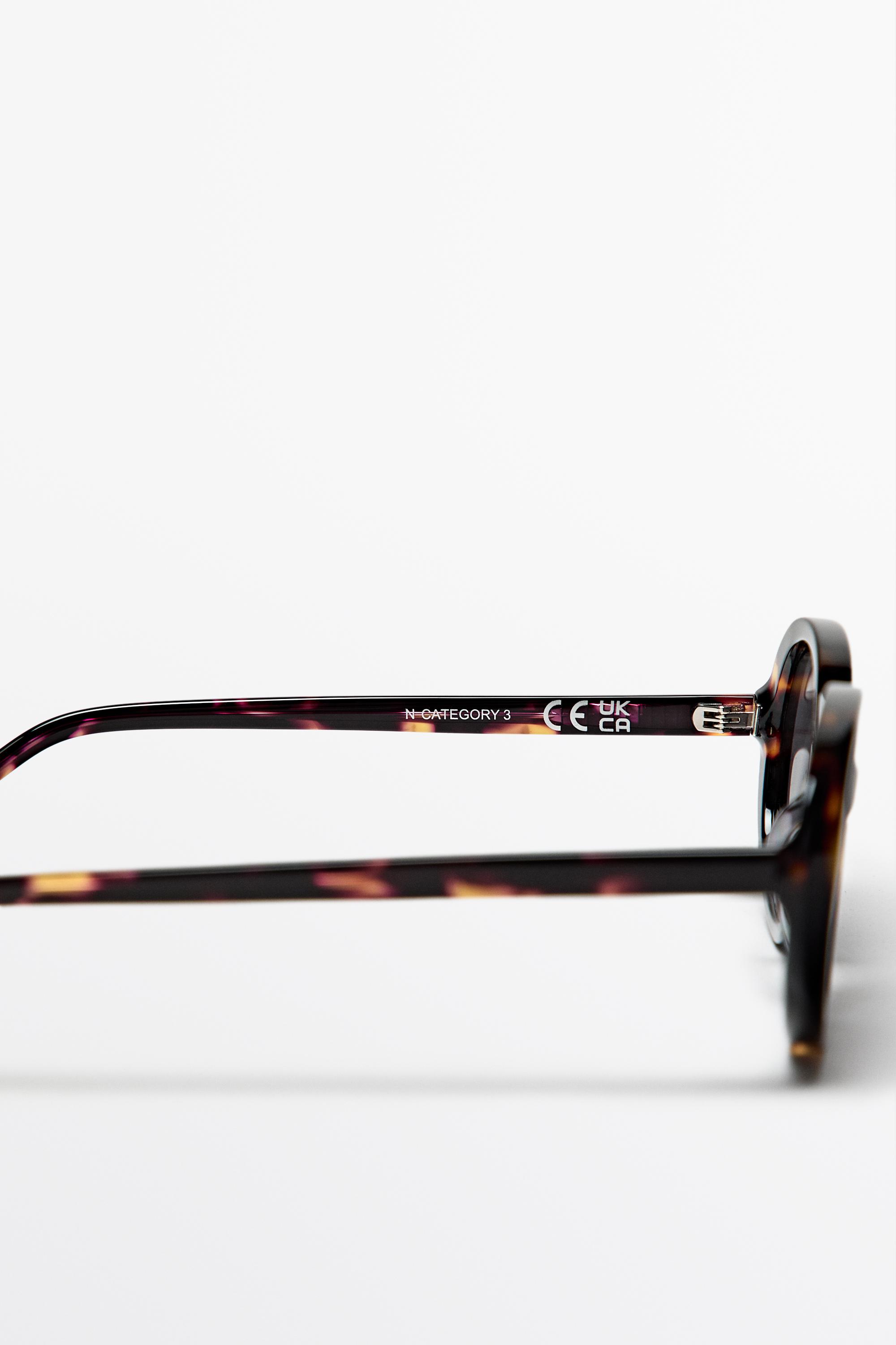 Oval tortoiseshell-effect sunglasses — BROWN