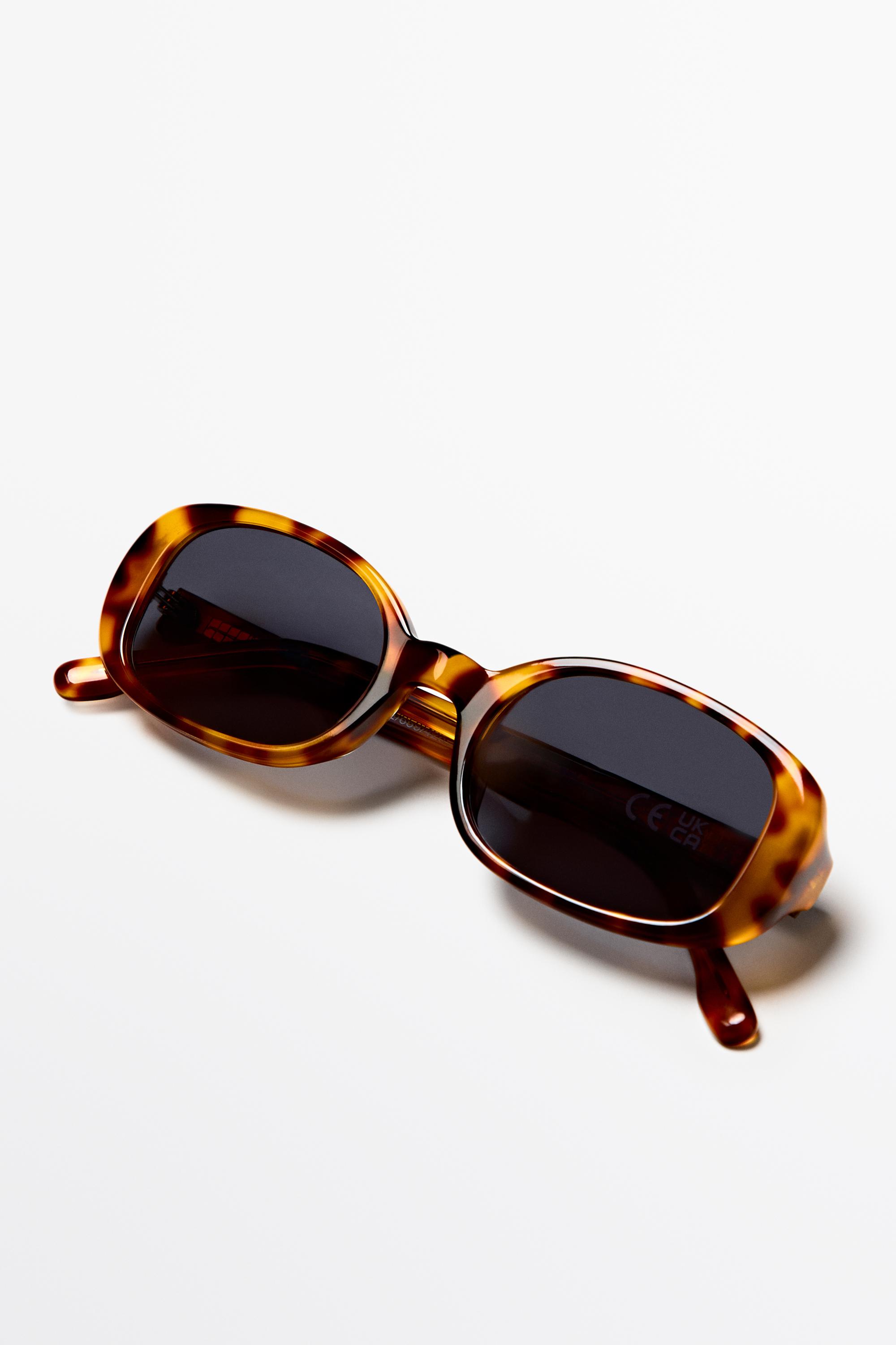 Oval tortoiseshell-effect sunglasses — Light Blue