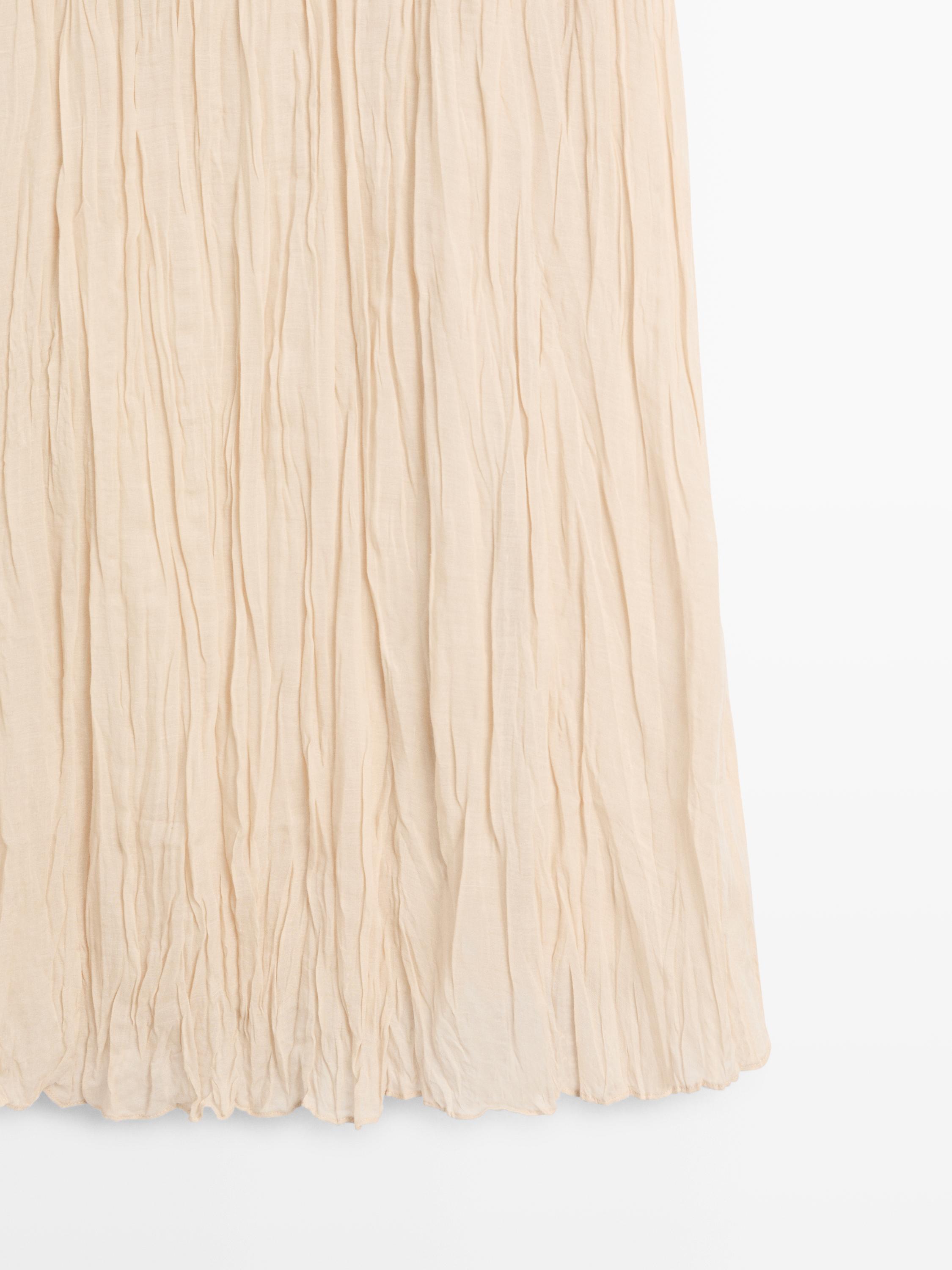Flowing midi skirt with pleated detail — CREAM